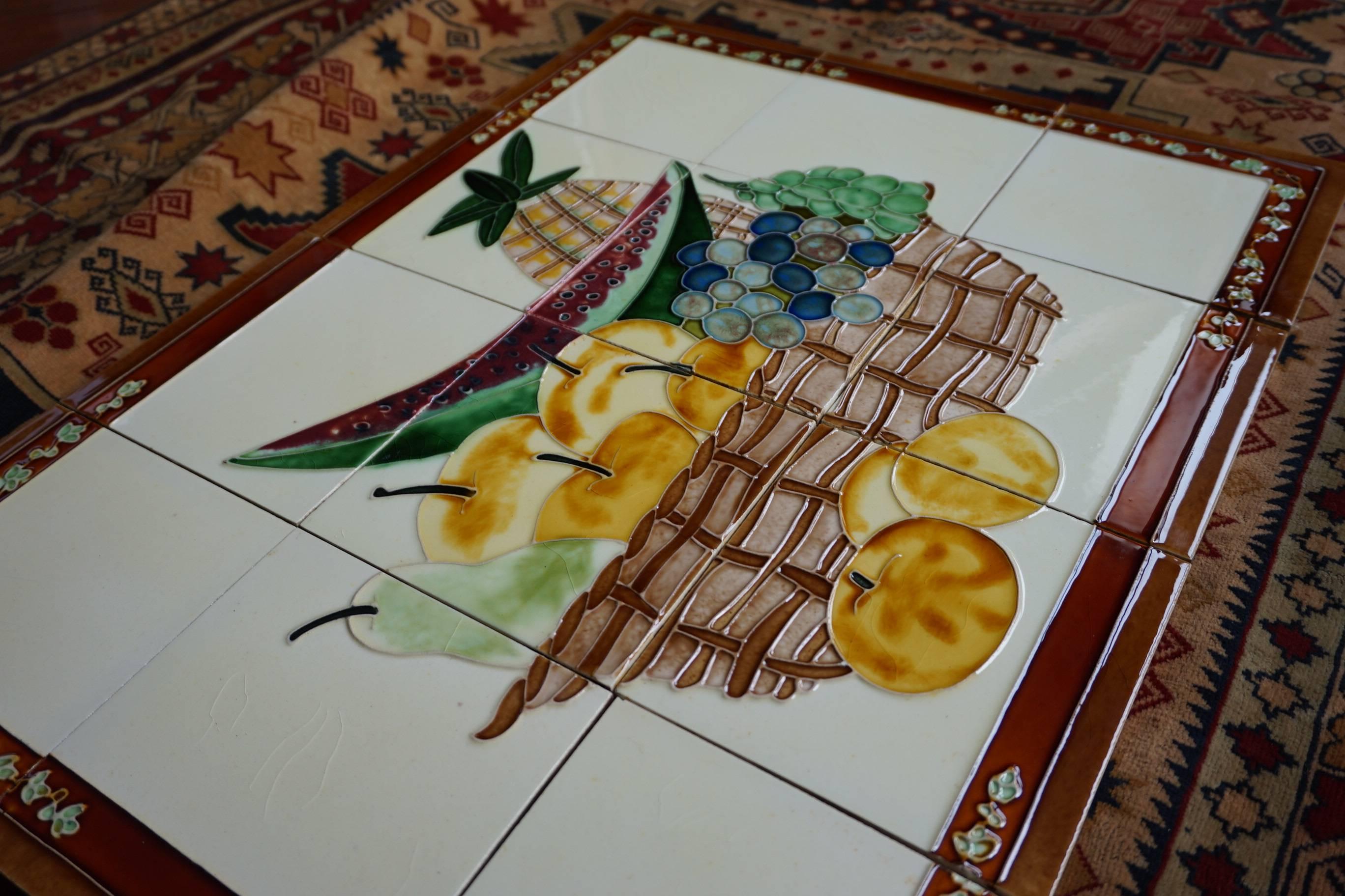 Colorful, bright and highly decorative tableau of 12 tiles.

This wonderful tableau of tiles from the midcentury period is in near mint condition. This wonderful 'tile painting' of a fruit basket is done in the most vibrant of fruity colors and the