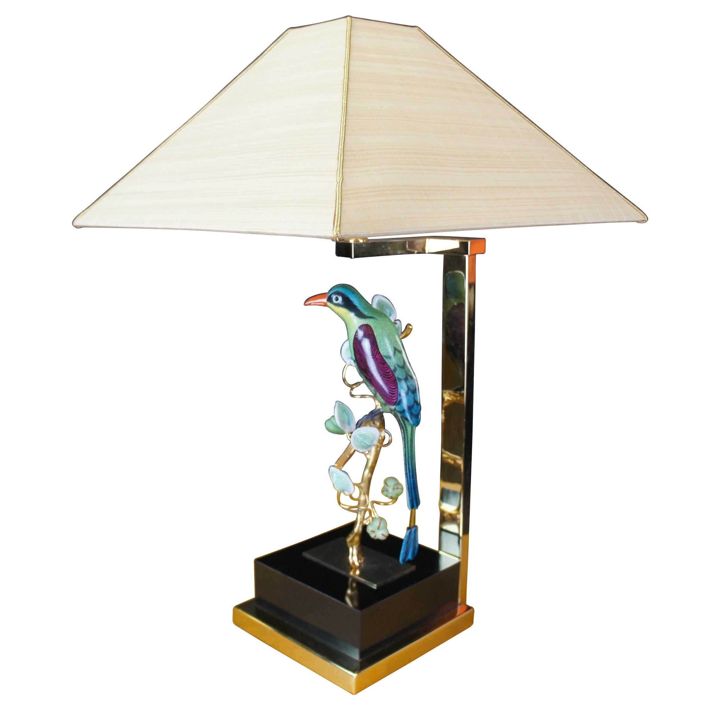 Vintage Mangani for Oggetti Italian porcelain and brass table lamp sculpture. Circa mid 1970s. Beautifuly detailed with vibrant colors. The Parrot is perched on a gold plated branch over a black plinth and brass base. A porcelain “objet d’art”