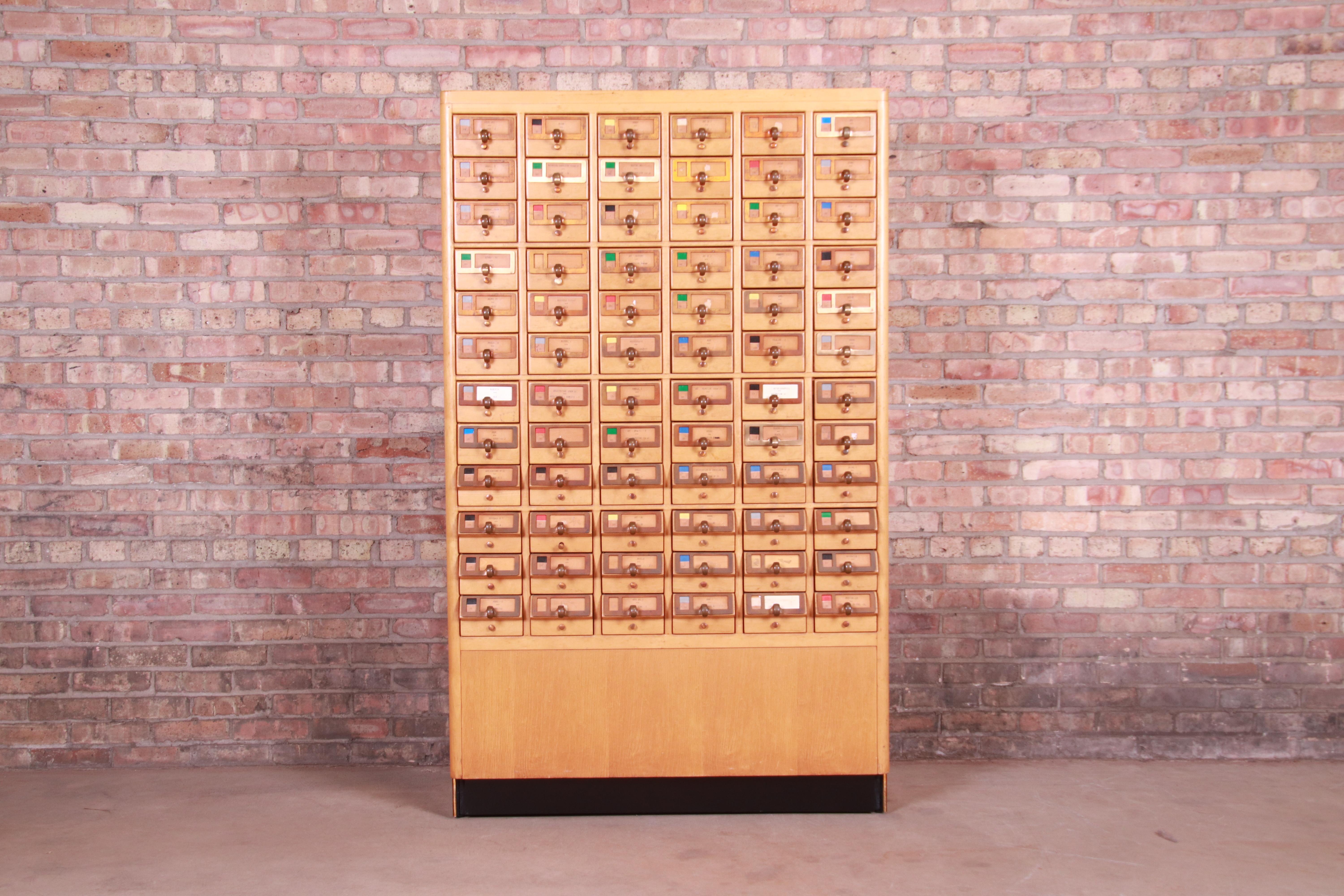 A rare and exceptional Mid-Century Modern or Art Deco 72-drawer library card catalog cabinet

USA, circa 1940s

Maple, with brass hardware.

Measures: 40.5