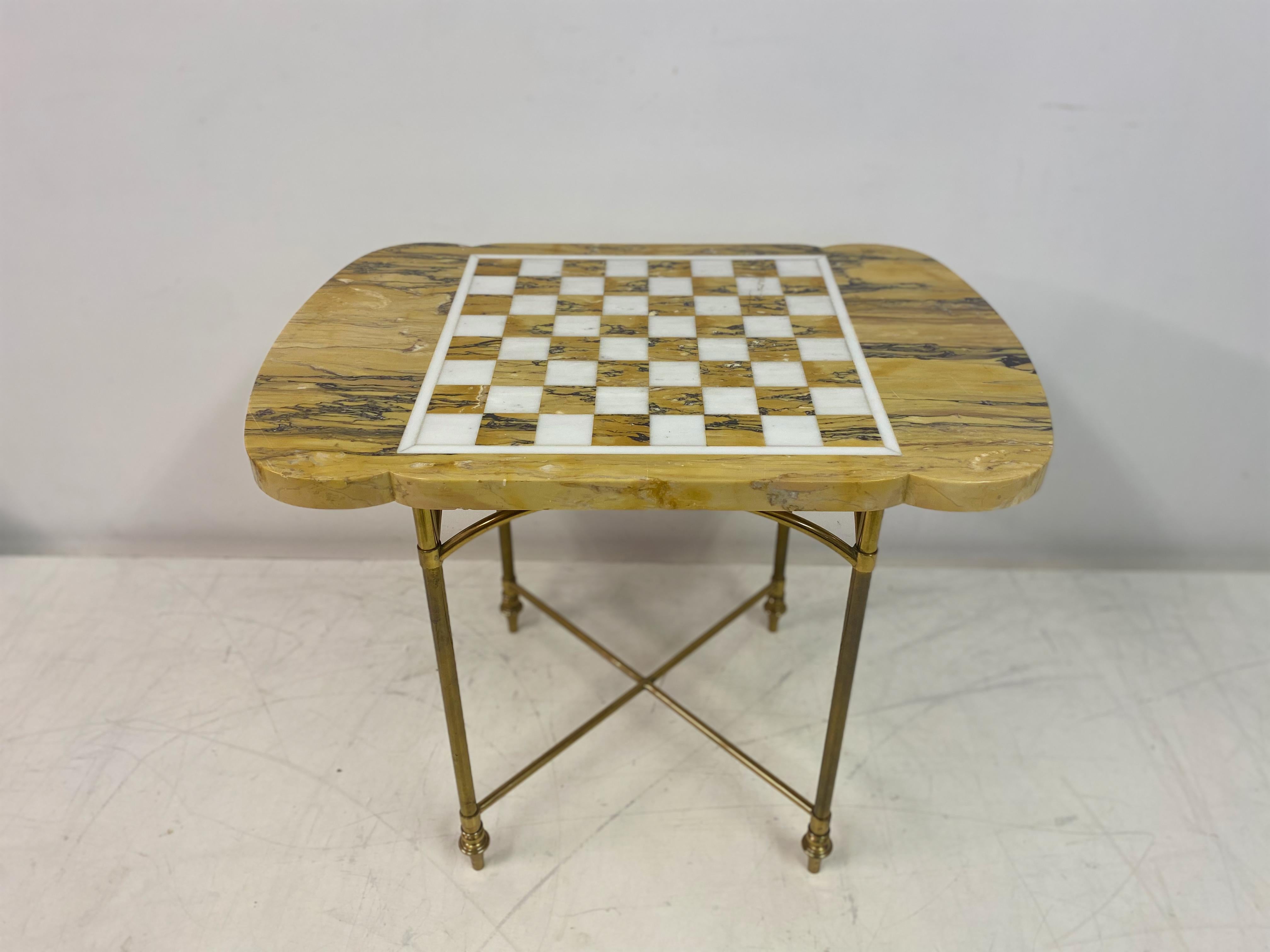 Games table

Brass frame

Marble top

Shaped ends

Mid to late 20th Century.