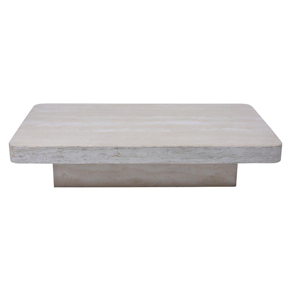 An Extraordinary Cocktail Table crafted out of travertine marble with an eye-catching rectangular top with rounded edges and rests on a sturdy floating base. This Minimalist Low Coffee Table would make a great addition to any home or office decor