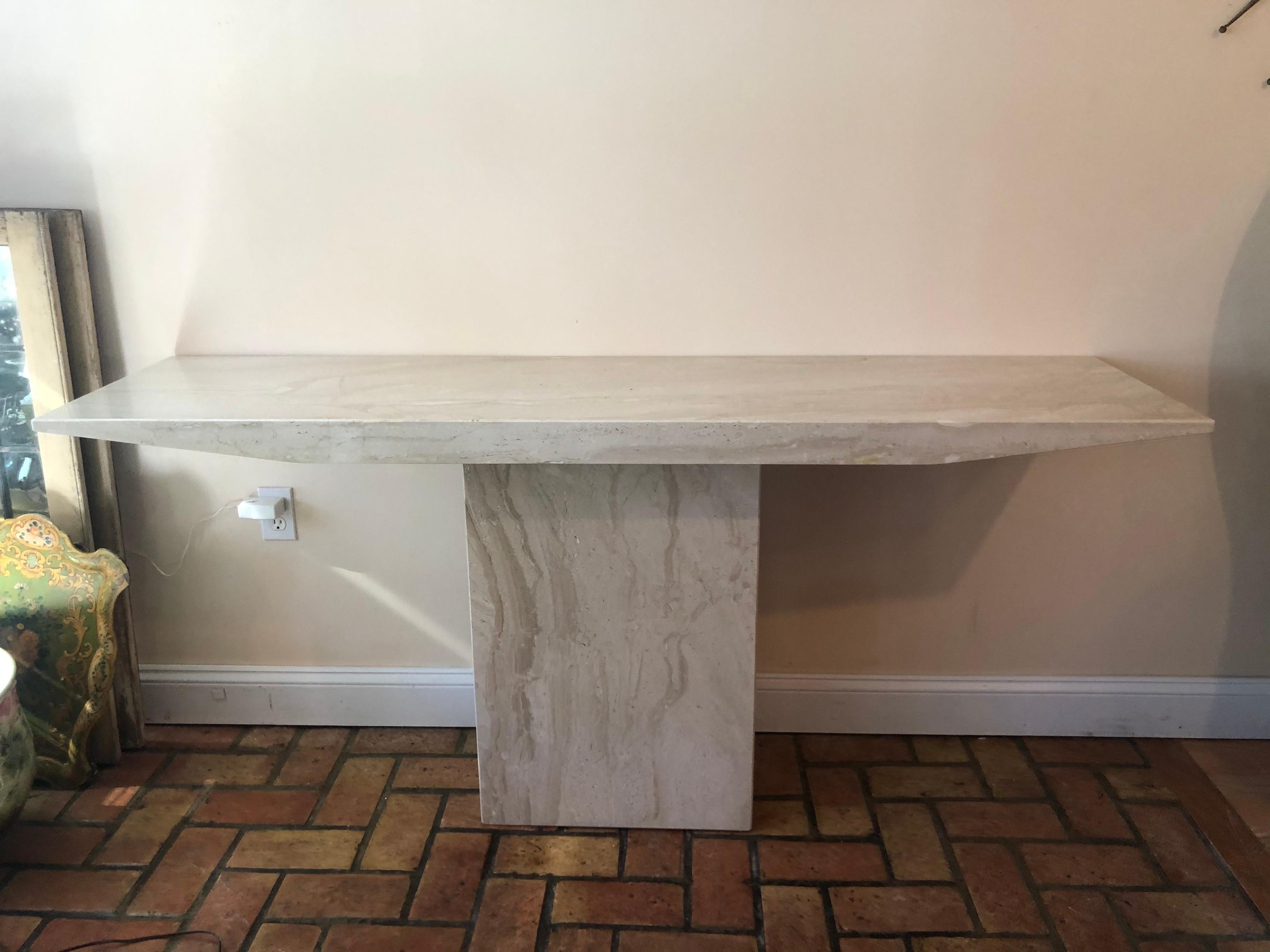 Mid-Century Modern marble console table. Minimalist lines with an organic feel. Perfect for an entry way or for a flat screen TV. Even use as a Mini bar/ counter with stools .The base width is 19.75