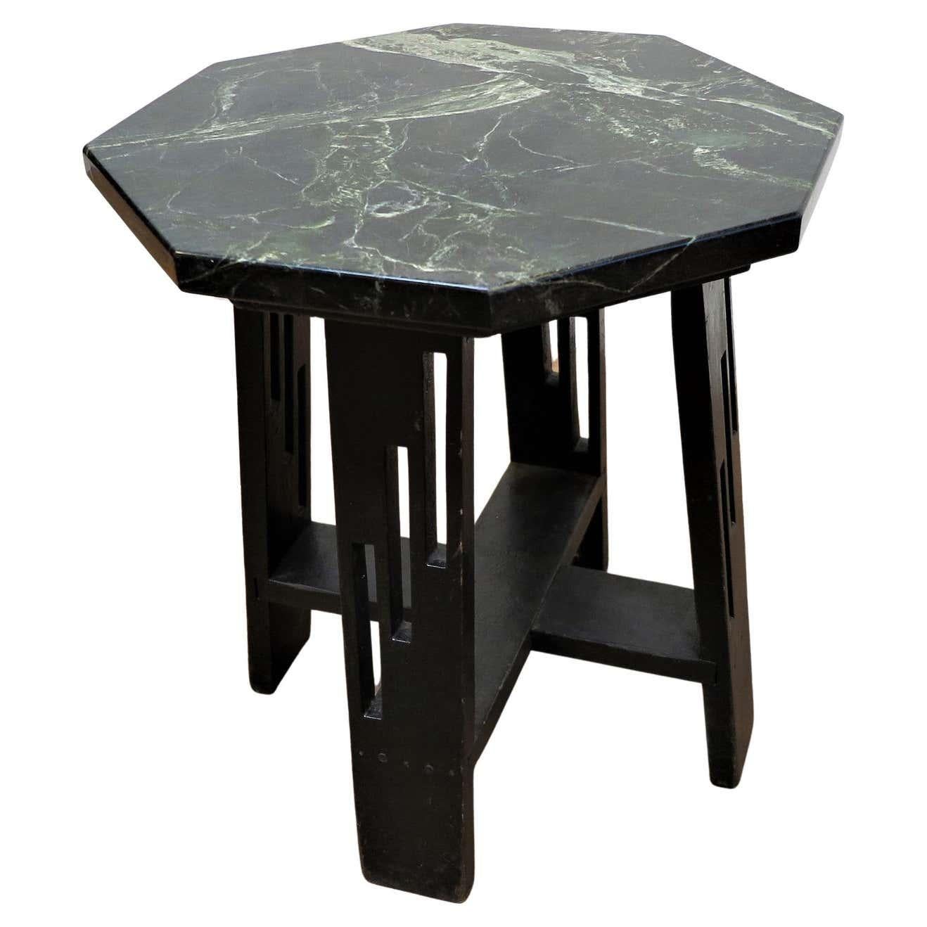 Arts & Crafts Mid century Hexagon marble toped side table. Early middle century, 1930-40 possibly earlier. Very nice black green hexagon marble top with polished soft edges set on four slightly splayed legs. Each leg having a staggered three slot