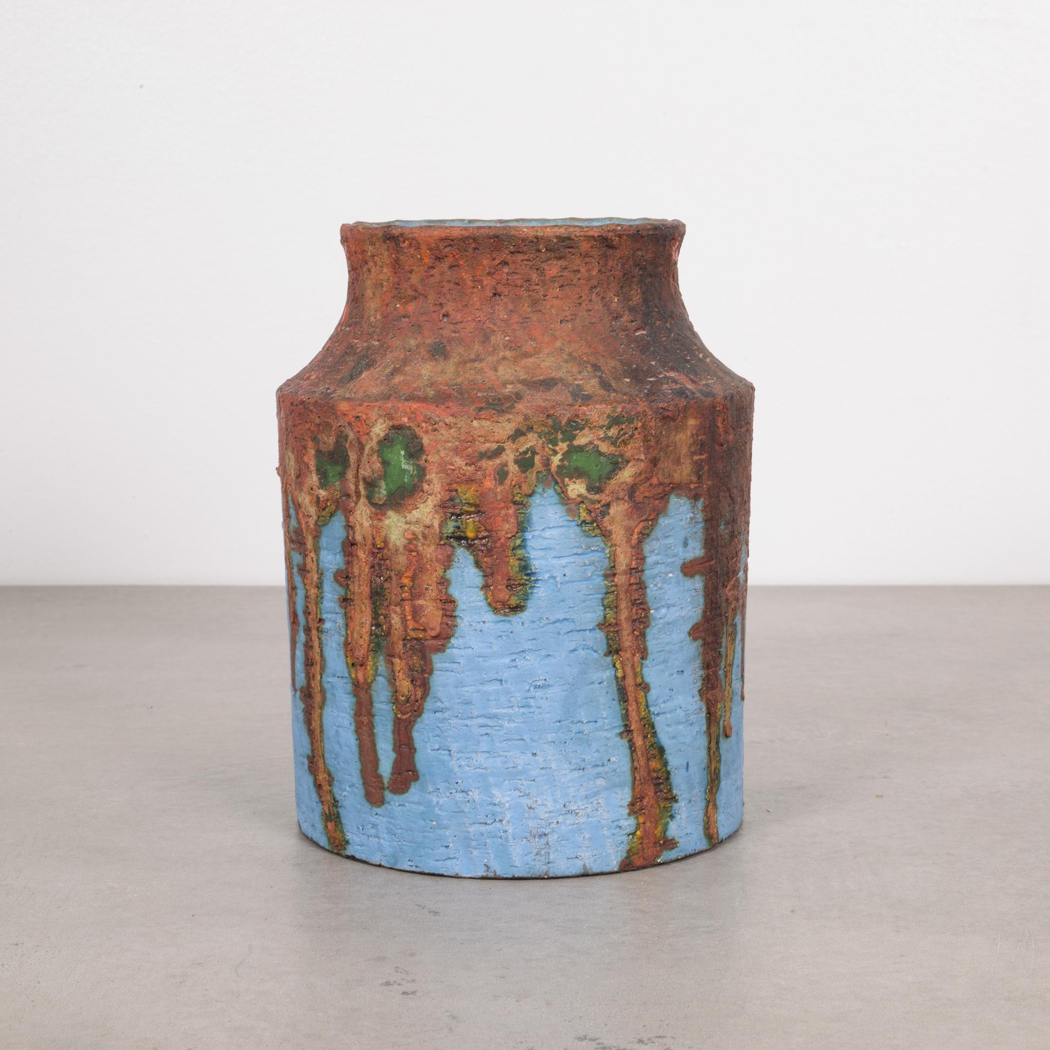 About

This is an original signed Marcello Fantoni glazed ceramic vase. This piece is numbered and signed by the artist. Hand-made earthenware with rough, matte burnt orange, blue and green glaze. This piece has retained its original