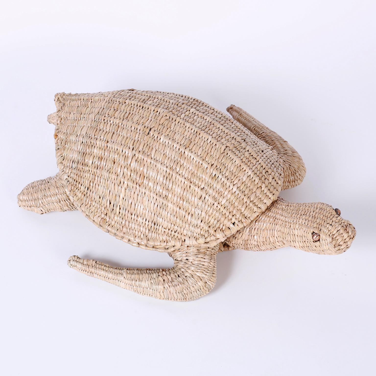 Amusing folky turtle sculpture or box crafted in wicker and ingeniously woven over a metal frame with a naive quality and a hinged shell for subtle secret storage. Signed Mario Torres on a brass medallion.