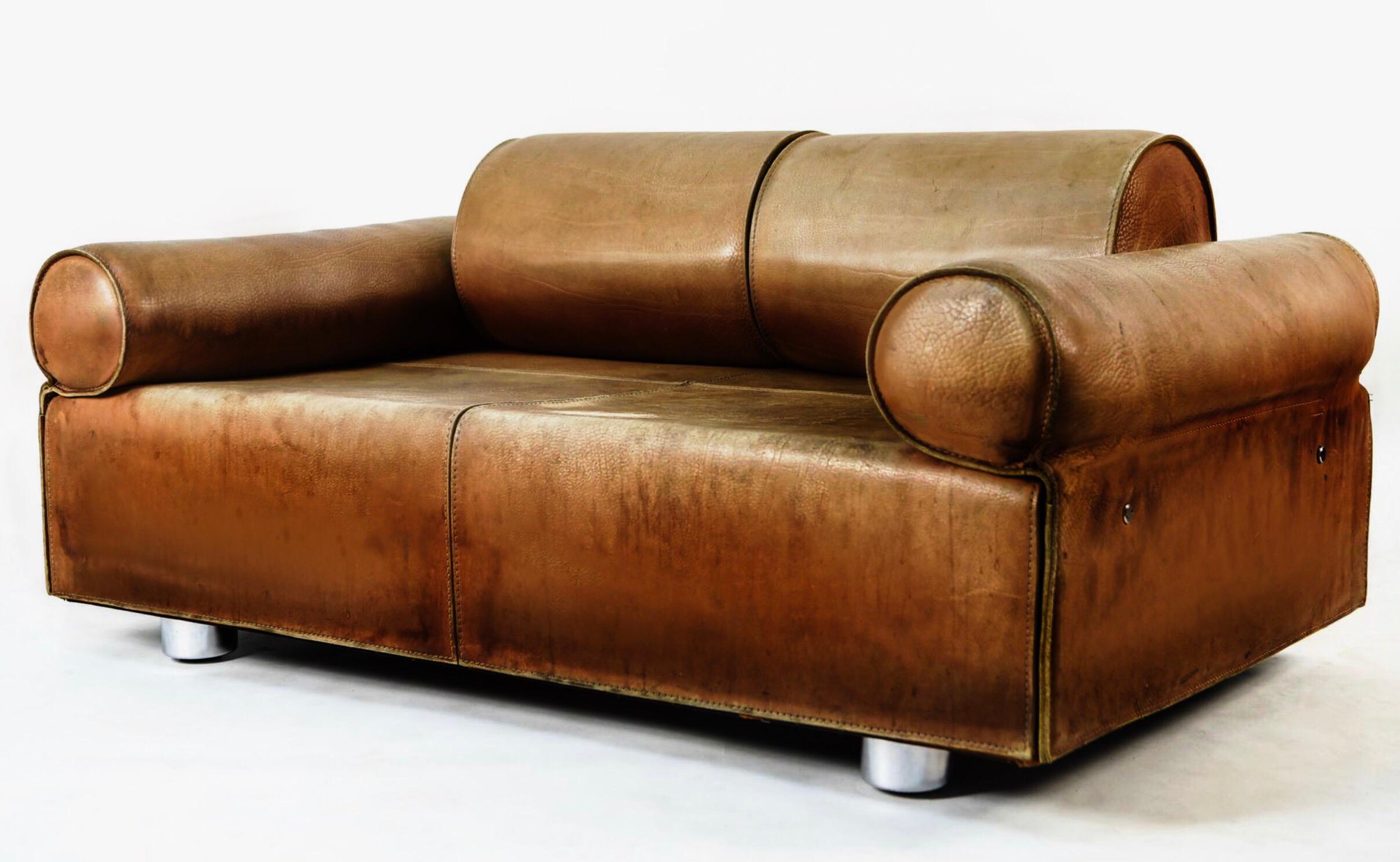 Rare buffalo two-seat sofa / daybed with Independently  adjustable back and arm rests / bolsters. Gorgeous patinated buffalo leather. Original hardware and legs.  by Iconic mid-century Italian designer Marzio Cecchi.   Exceptionally rare piece,