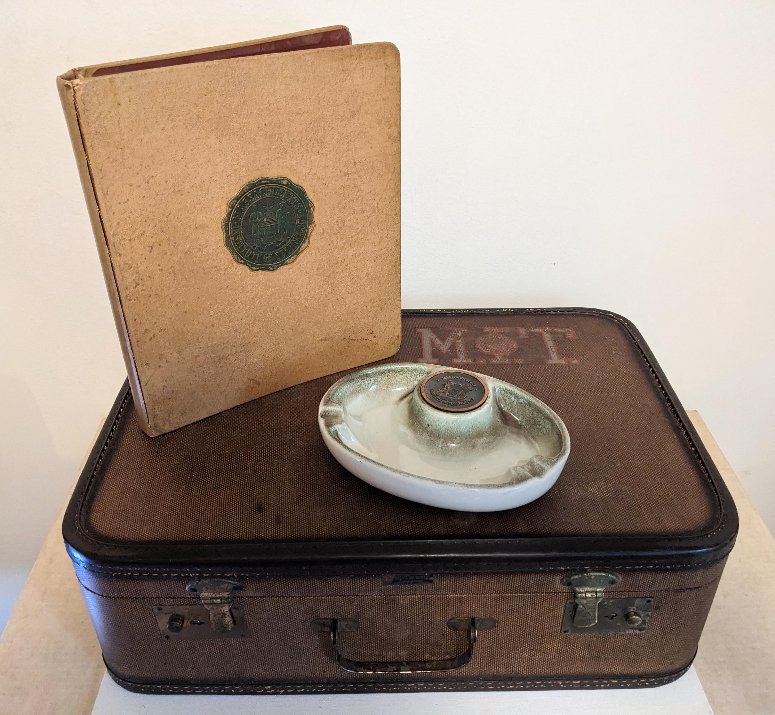 Mid Century Massachusetts Institute of Technology Collectibles. Upgrade your legacy and clout with a few well placed trinkets from Mid Century M.I.T. scattered around your home.
Includes suitcase with MIT label, Ashtray and Binder. 1950 USA. 
