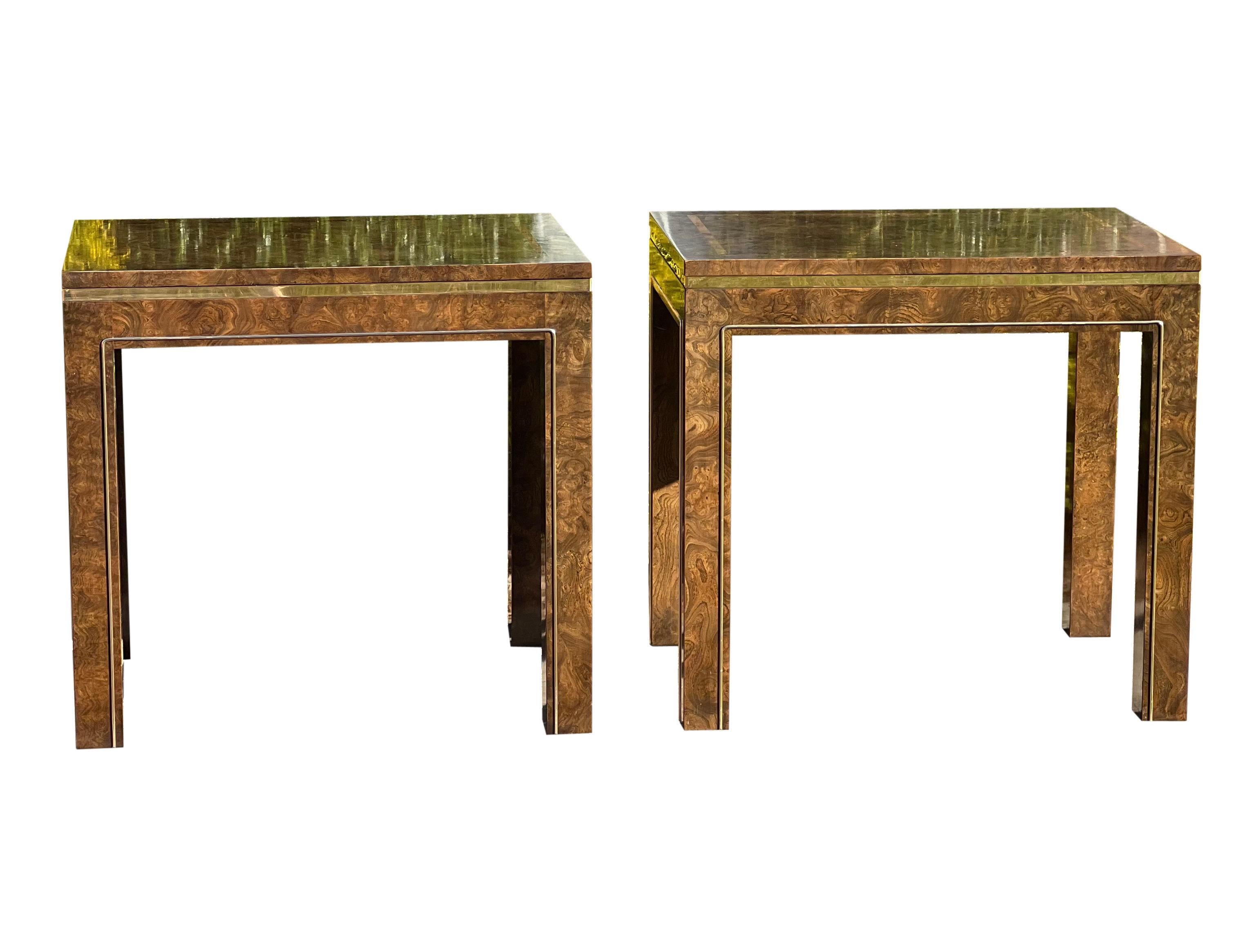 Stately pair of Parsons style Hollywood Regency burl wood side/end tables by Mastercraft, 1960's. The pair features burl veneer throughout with brass accent trim. Tables are rectangular in shape. An elegant and stunning pair in good vintage