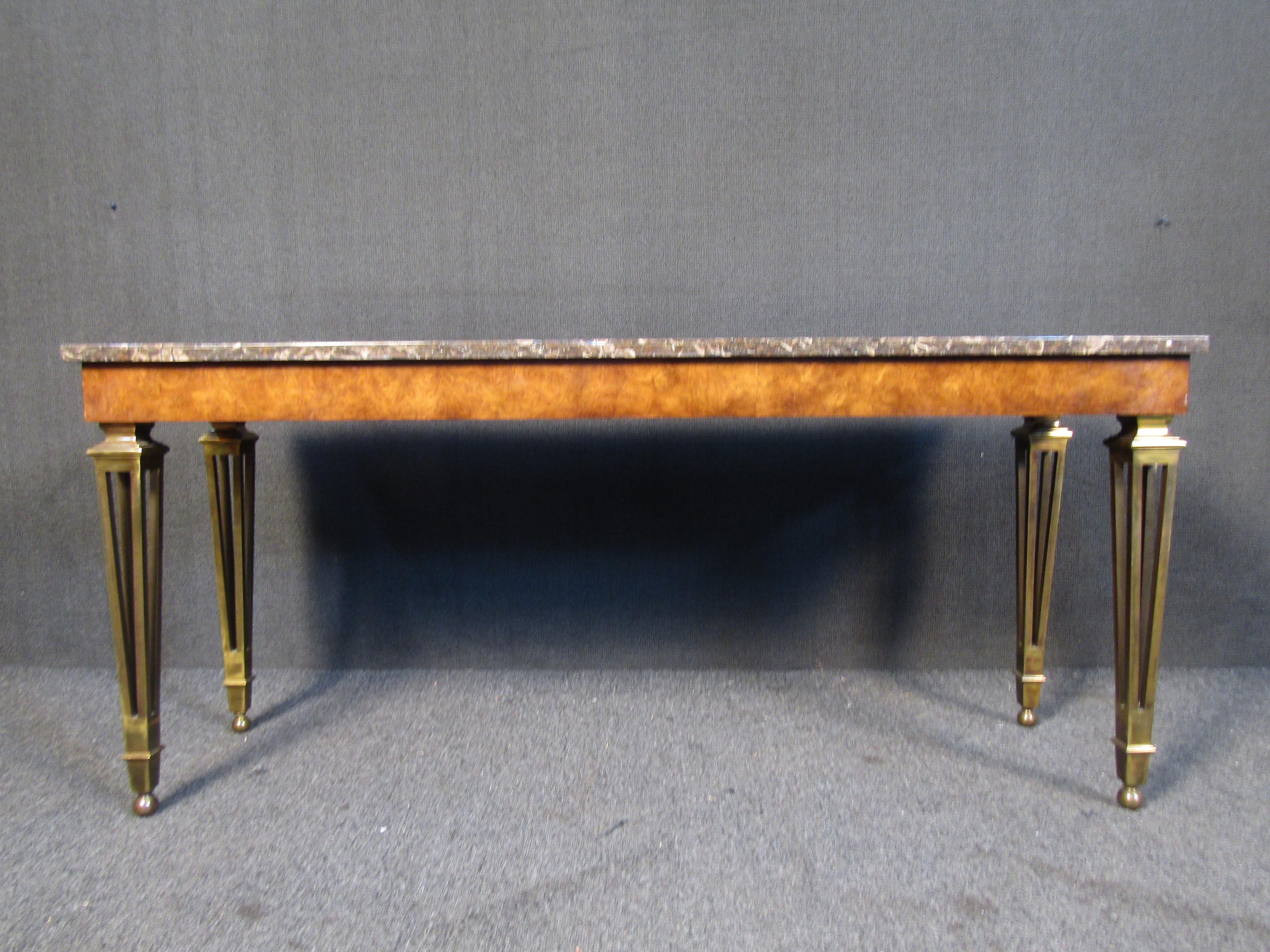 A vintage console table by Mastercraft that combines marble, burl wood, and ornate brass legs for a stunning Mid-Century Modern look. Please confirm item location with seller (NY/NJ).