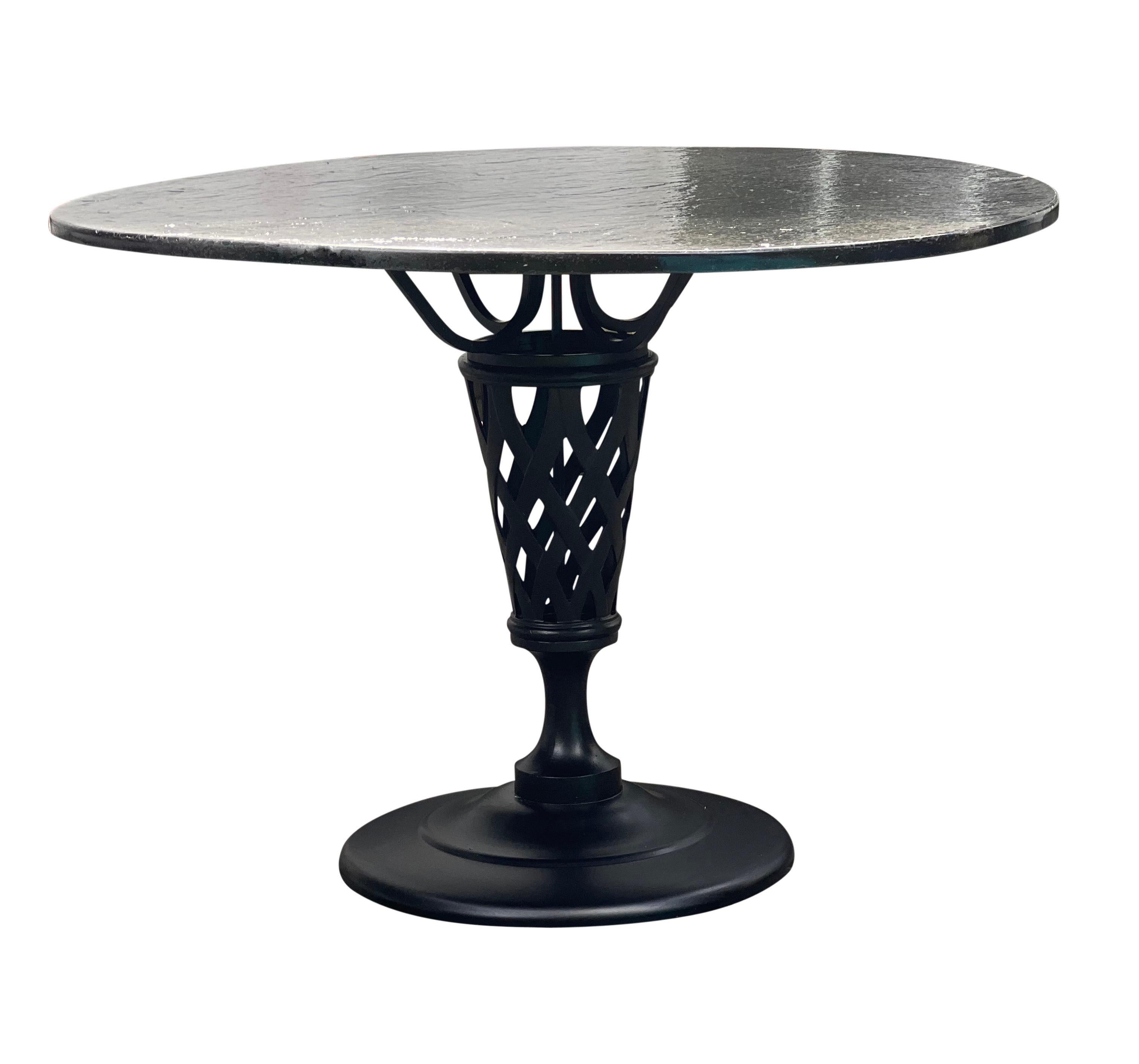 Fabulous vintage cast aluminum indoor/outdoor dining set newly reupholstered, professionally sandblasted and powder-coated in matte black with a texturized black slate tabletop.

This unique table features a pedestal base with a chunky basketweave