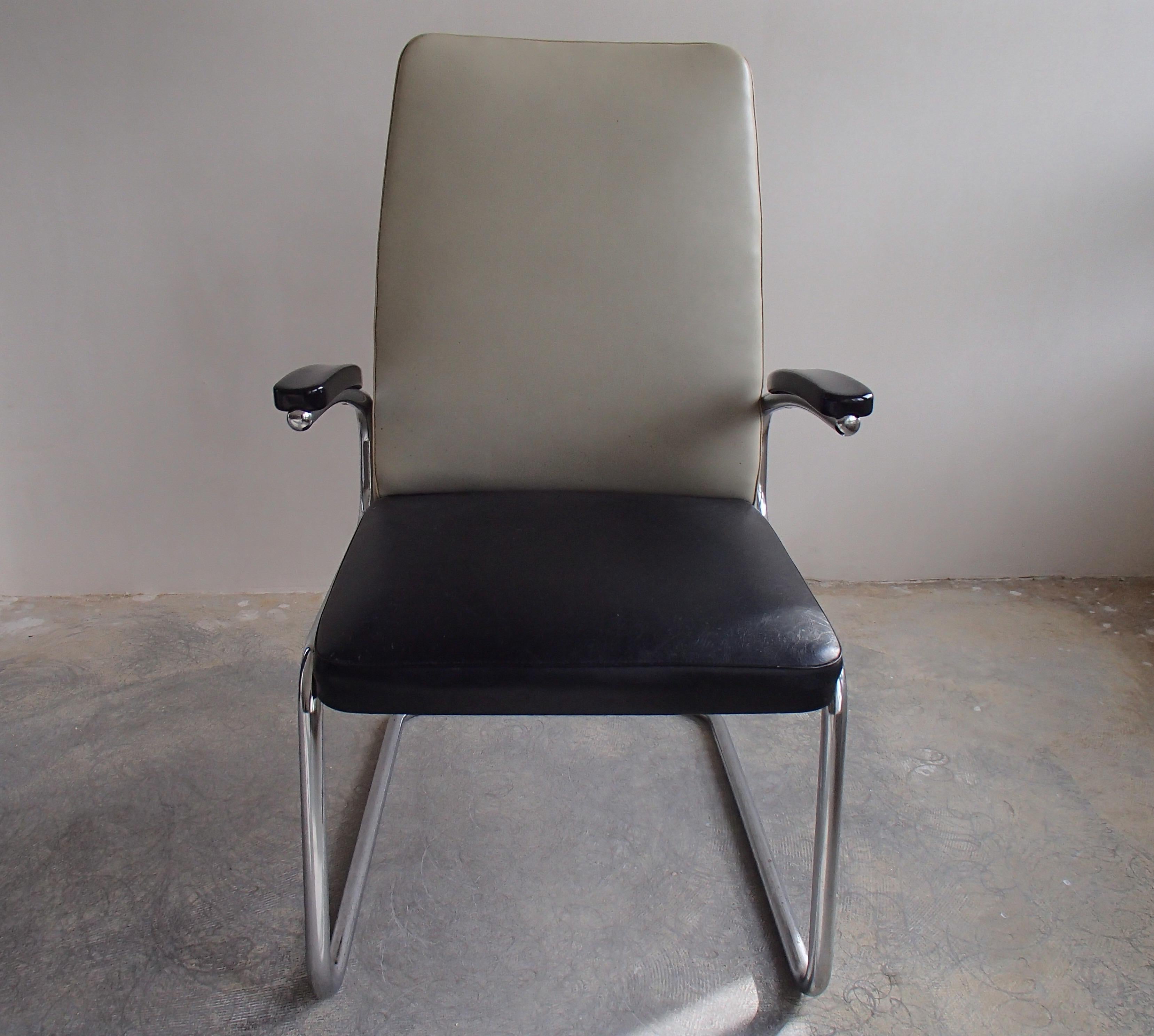Midcentury Mauser armchair with original leatherette grey and black.