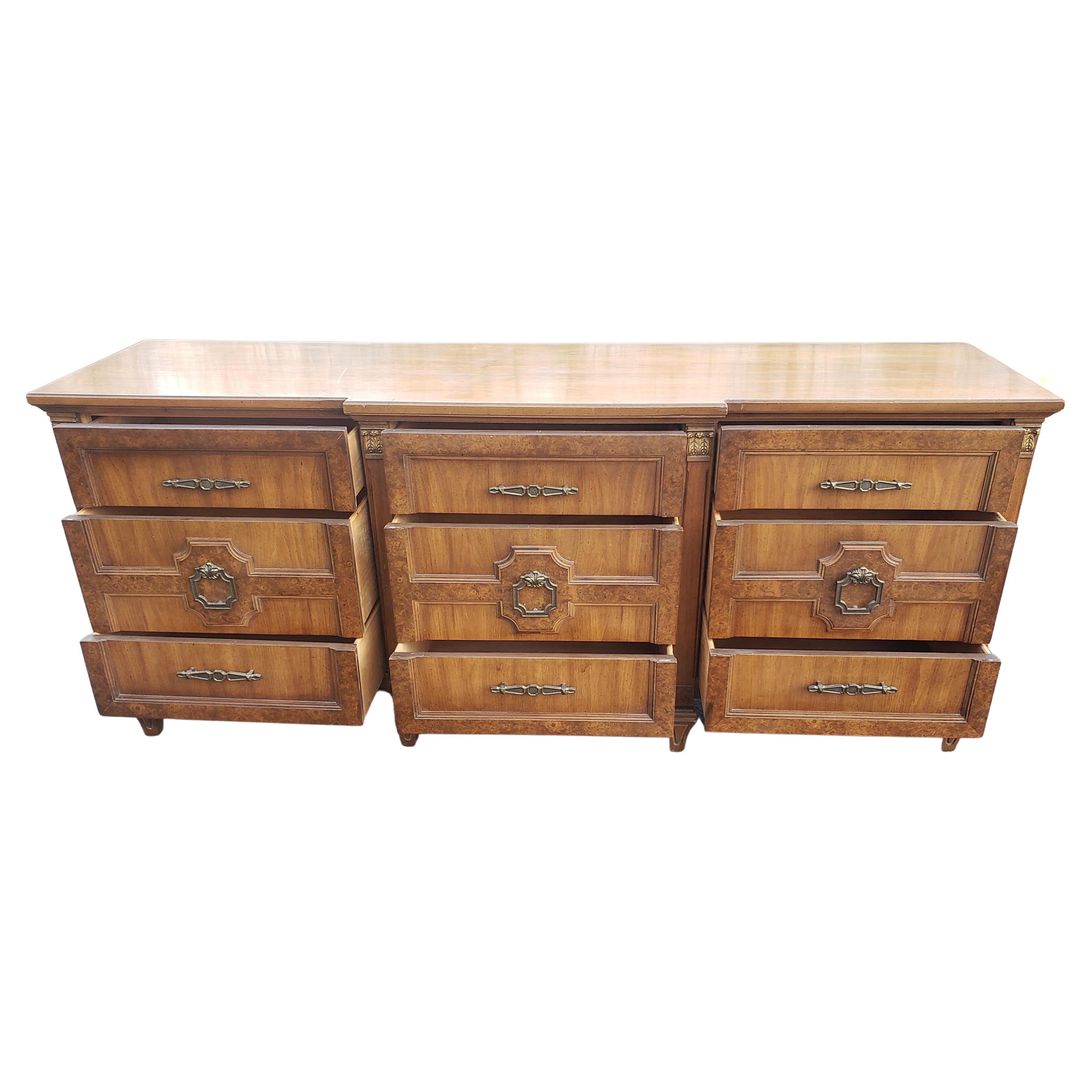 Midcentury Mazor masterpiece burl walnut wide triple dresser with giltwood accents and original hardware.
Measures 76