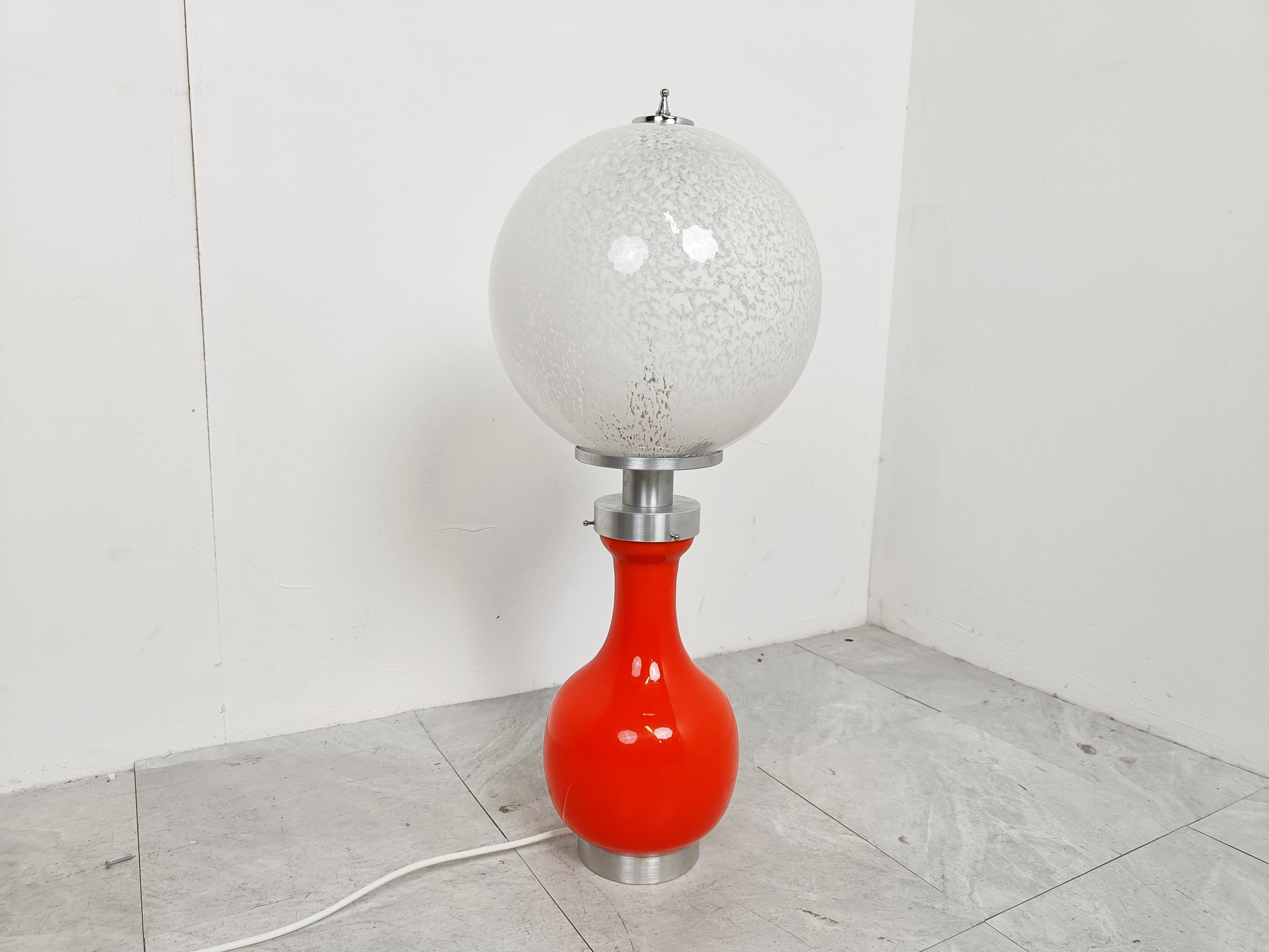 Midcentury table lamp by Mazzega with white and orange opaline glass and chrome.

Beautiful midcentury lamp which emits a soft DIM light.

Good condition, tested and ready to use.

You can illuminated both upper and lwoer part of the lamp