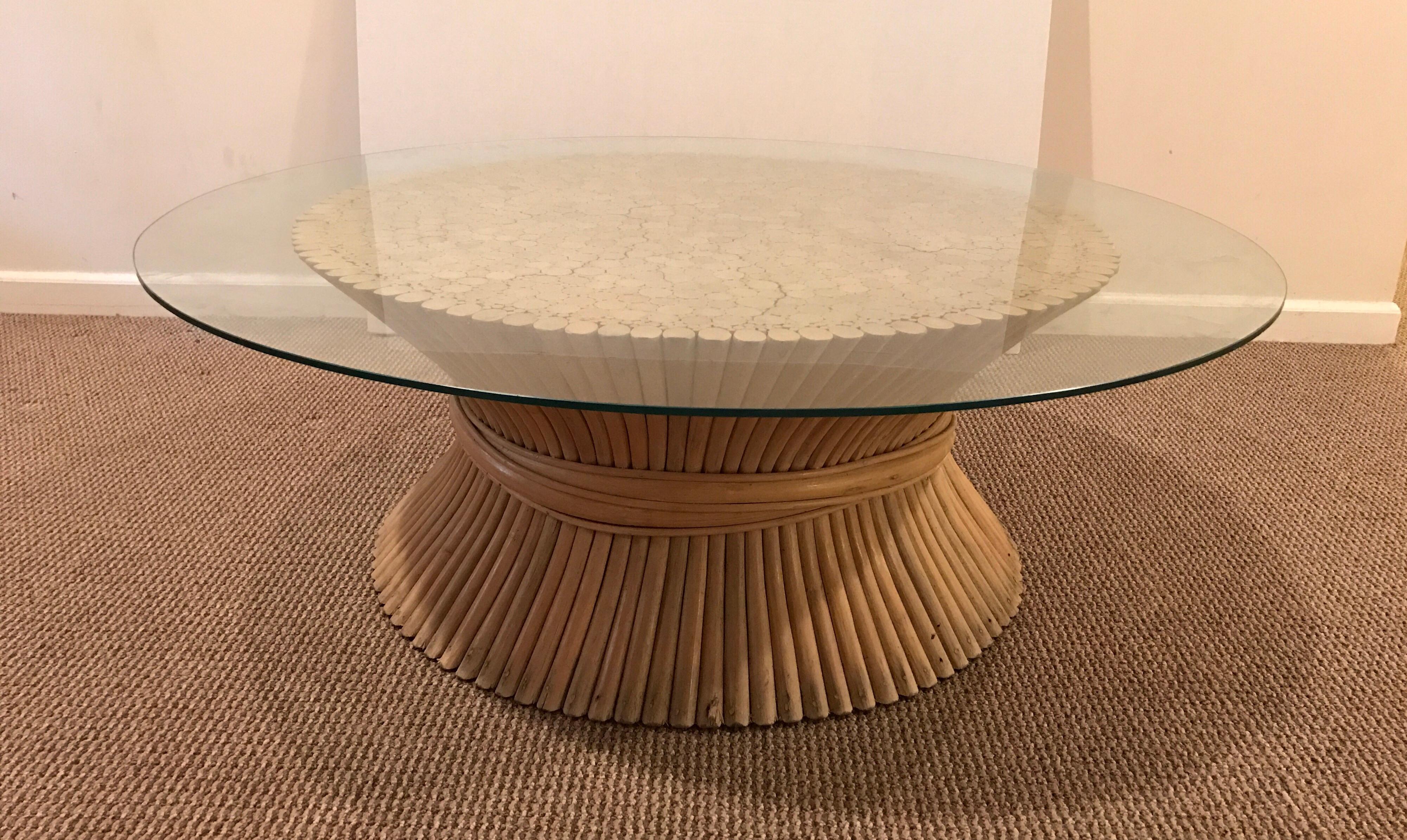 Designers John and Elinor McGuire used bamboo reeds to create this bundled wheat sheaf table. It measures 36” wide x 16” high and has a 3/8” thick x 48” wide glass top.
  