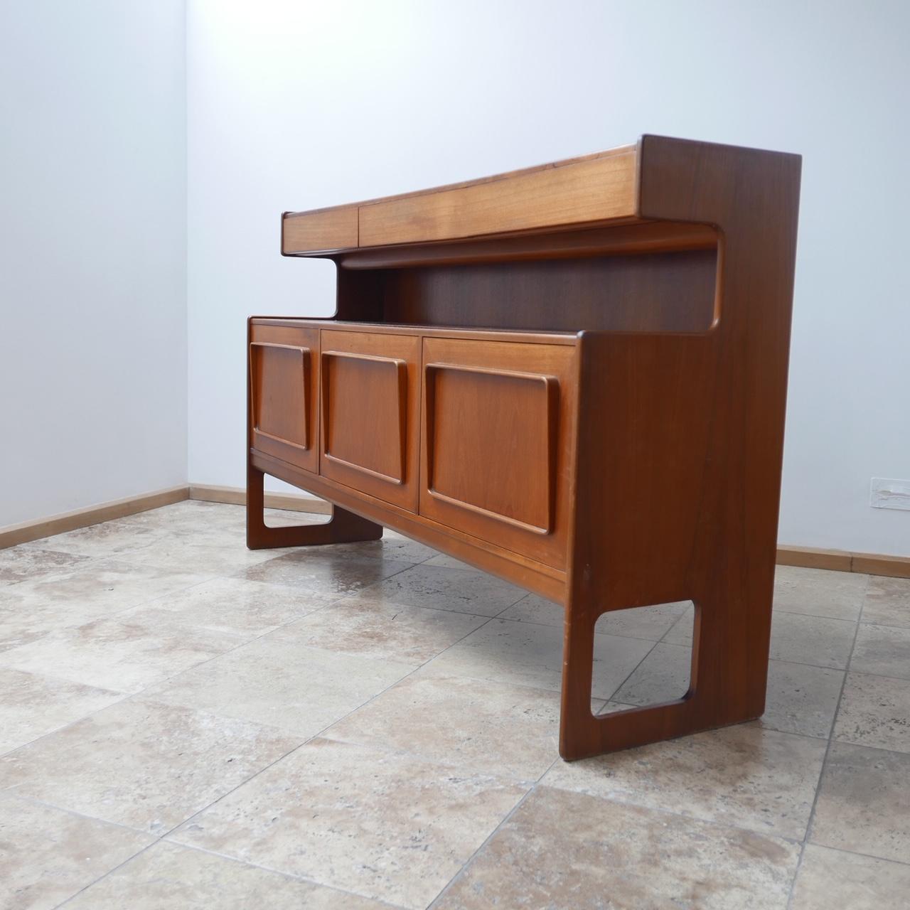A rare sideboard by McInstosh. 

Late 1960s-1970s. 

Scottish, UK. 

Three drawers top tier over three lower cabinets. 

Highly functional. 

Perfect to put a tv over as an example with the drawers for remotes and the cabinets for boxes