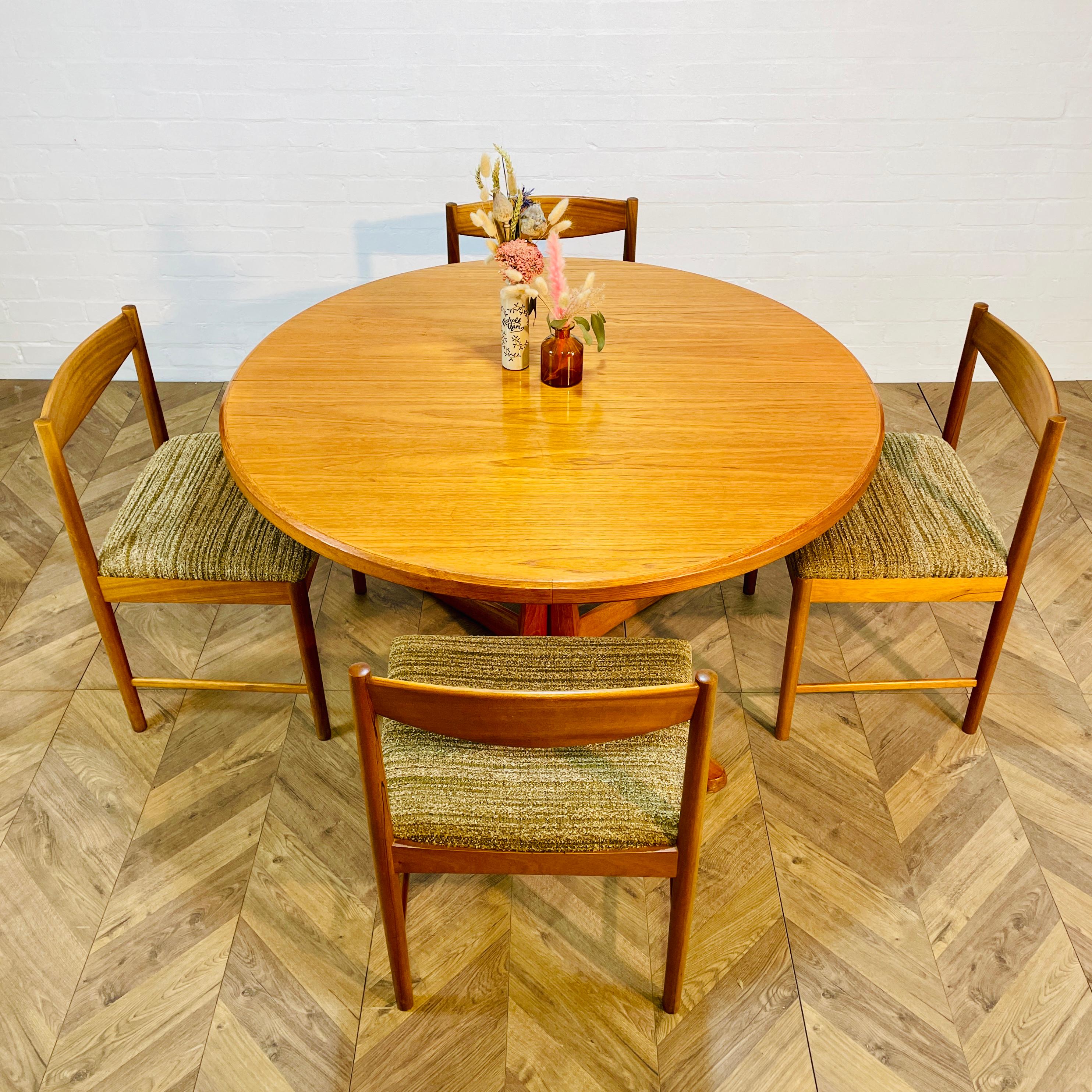 A Lovely Vintage Mid-Century Double Extending Teak Dining Table Plus 8 Dining Chairs (Incl. 2 Carvers) by McIntosh Of Kirkcaldy, dated, April 1976.

A beautifully designed circular table, with 2 extending leafs, which extends to an impressive 220 cm