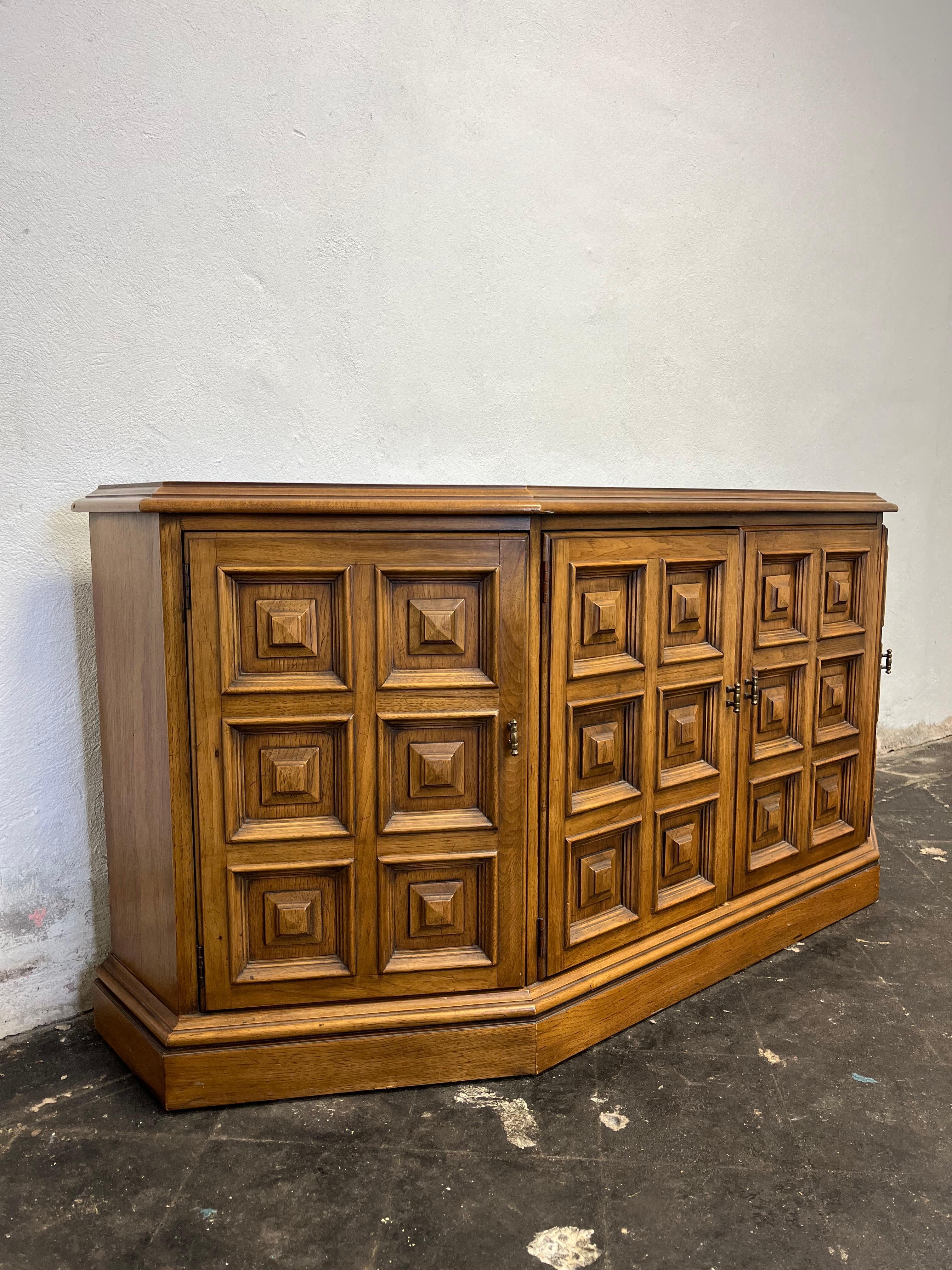 Classic Drexel Esperanto buffet with pillow tufted facade. Mediterranean design with ample storage with drawers and adjusting shelves. Great visual appeal.