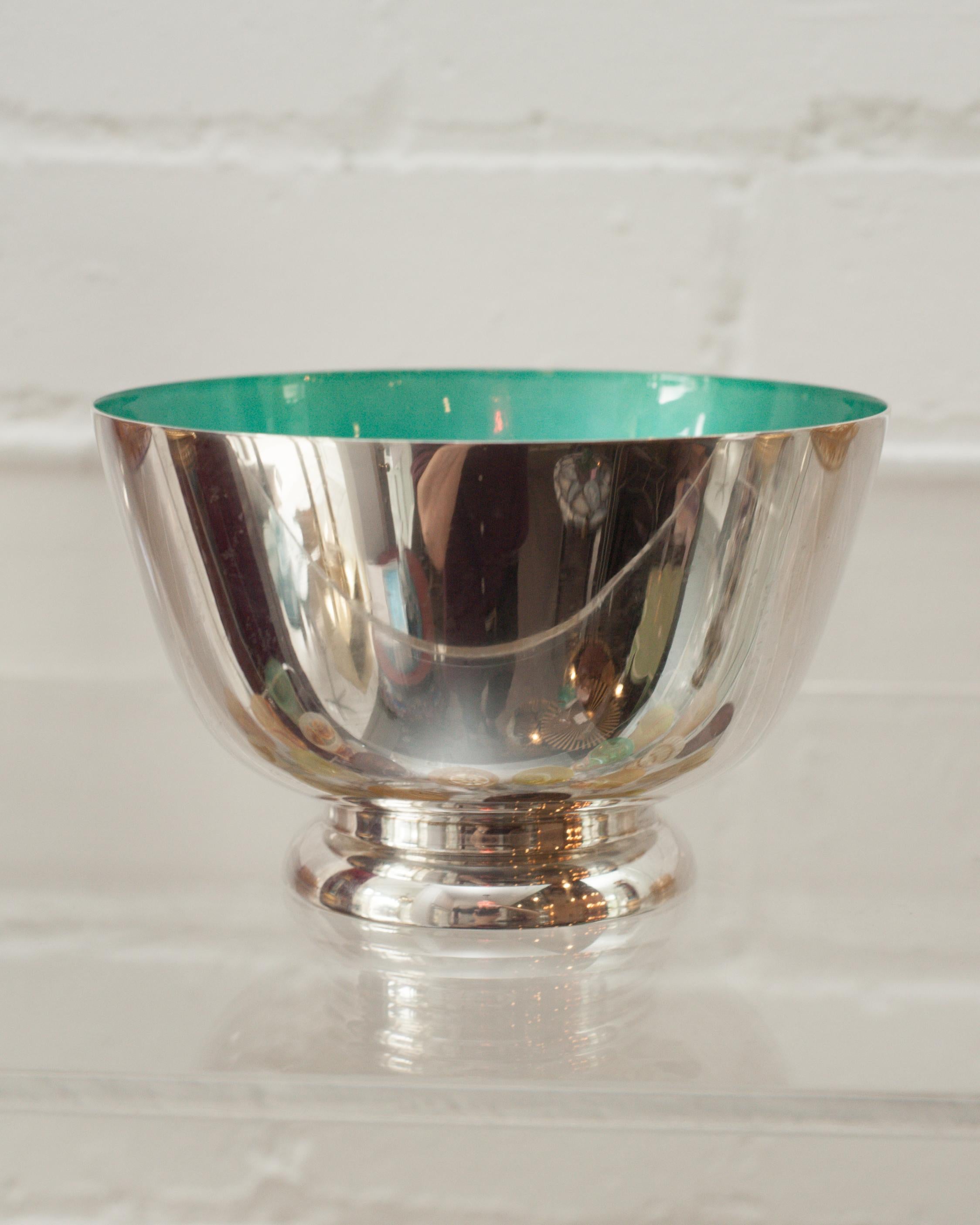 A beautiful midcentury sterling silver bowl with turquoise blue enamel lining. This Revere style bowl is perfect for fruits, candies, nuts. Due to the vibrant interior color, this vessel is a beautiful empty as filled.