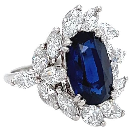 One Mid Century Mellerio Paris GIA No Heat Sapphire Diamond Platinum Ring. Featuring one GIA certified oval mixed cut blue sapphire of approximately 3.70 carat, accompanied with certificate #5222499266 stating the sapphire has no indications. of