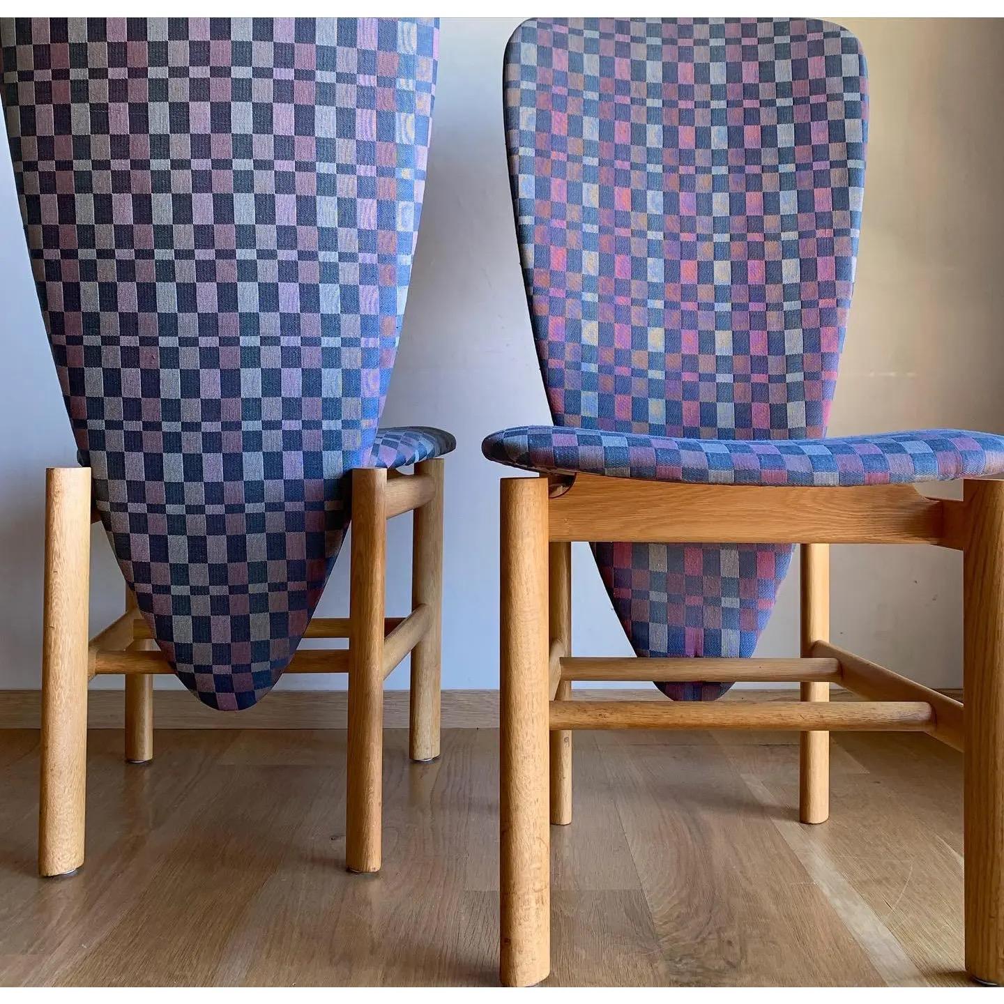 For the groundbreakers and envelope-pushers, a rare and incredible set of Memphis Style high backed dining chairs with elongated abstracted triangular design. Architectural bases are made of solid European white oak.
Stunning and unexpected, these