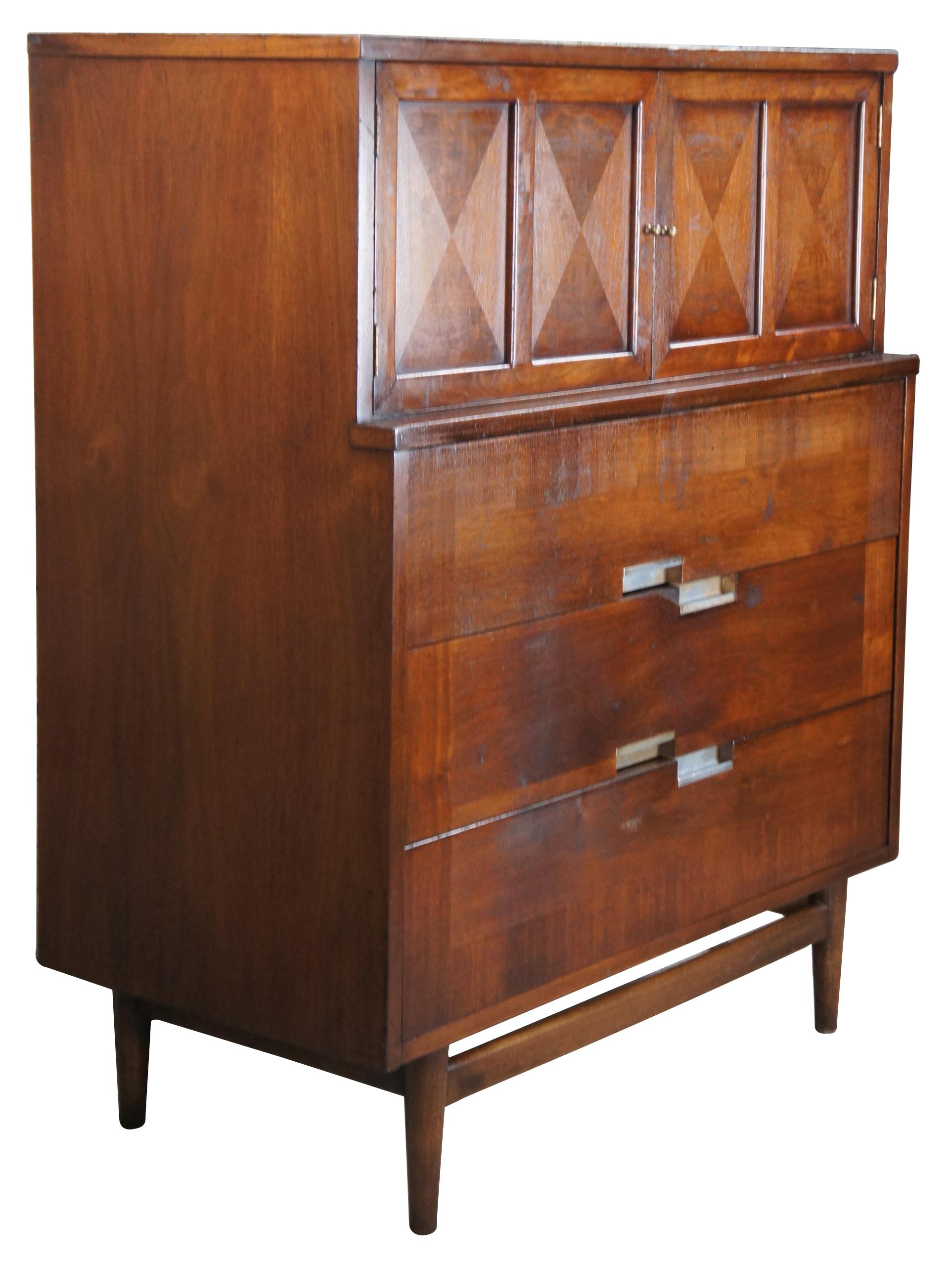 Mid-Century Modern Accord Bachelor Chest of Drawers designed by Merton Gershun, American (1909-1989) for American of Martinsville. Made of walnut featuring inset X top with upper bookmatch panel cabinet that opens to two drawers, over three more