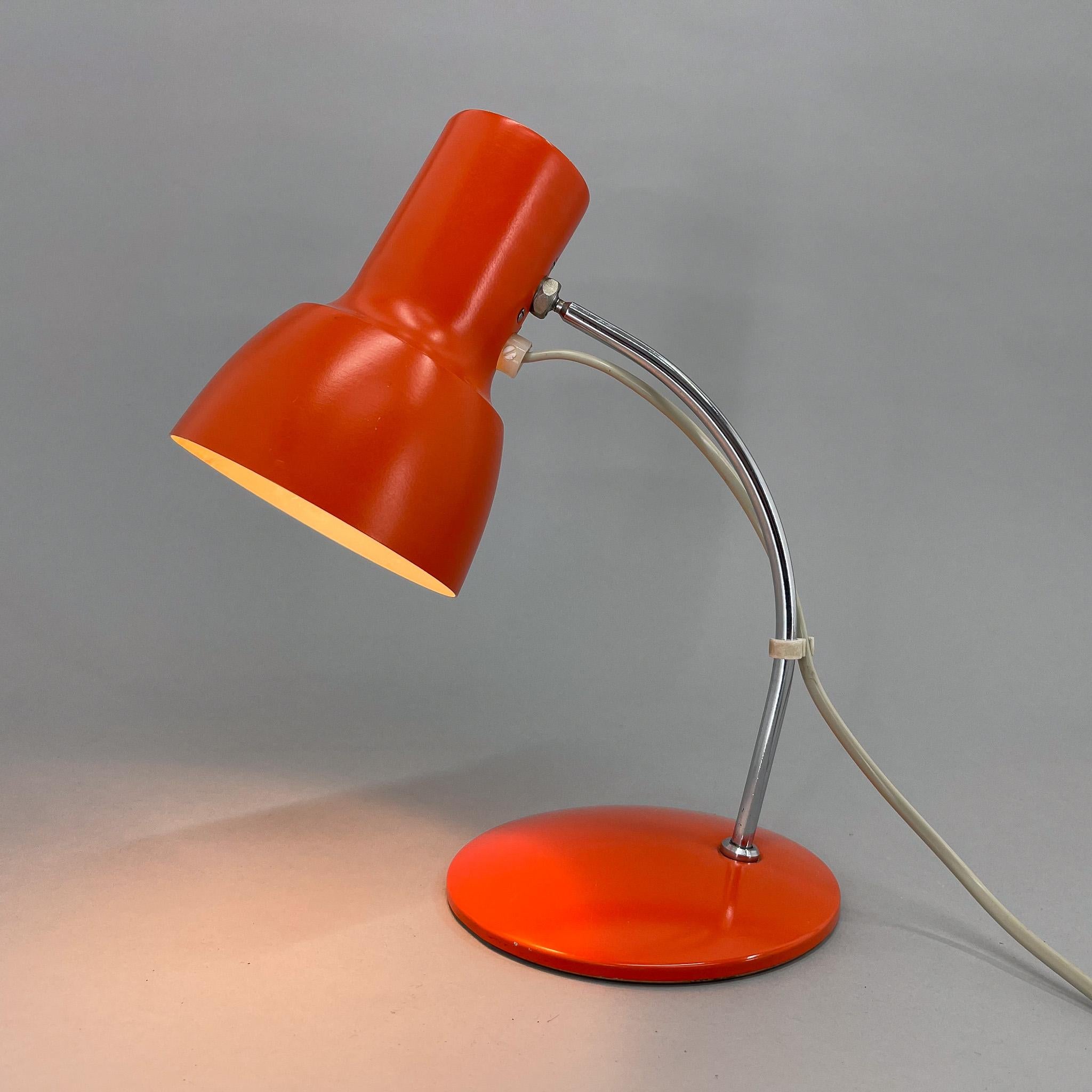 Vintage orange metal and chrome table lamp with adjustable lamp shade. Produced in former Czechoslovakia in the 1970's. 
Bulb: 1x E14. US plug adapter included.
