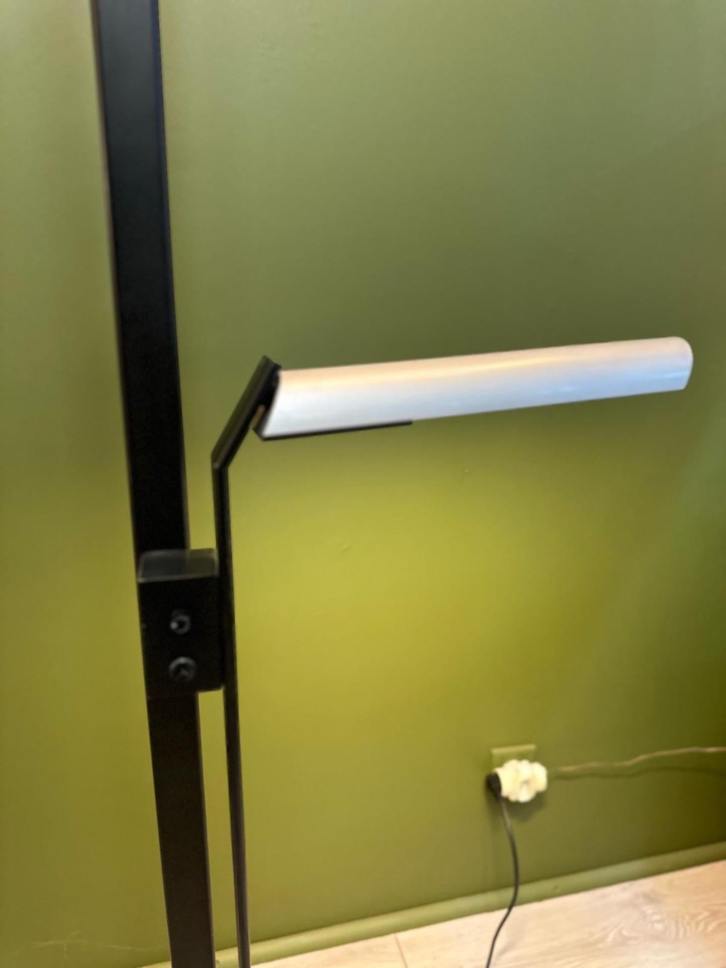 Very nice and rare Mid-century floor lamp made in black laquered metal and the two lampshades in anodized aluminium. This very original floor lamp has been Designed by the famous French designer Sabine Charoy. This is the 
10592 model, that has been