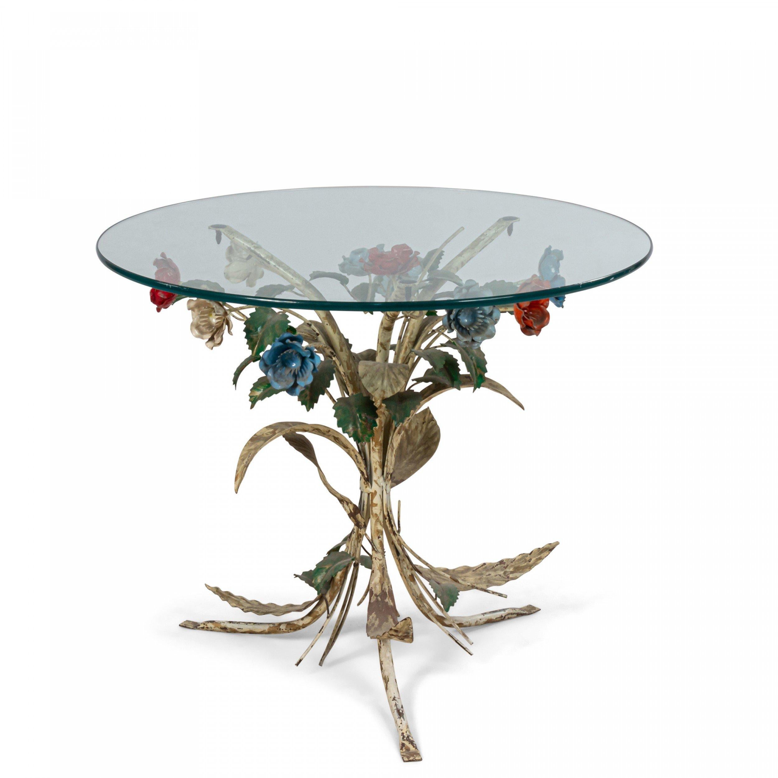 Mid-Century coffee table with painted shaped metal floral base and circular glass top.