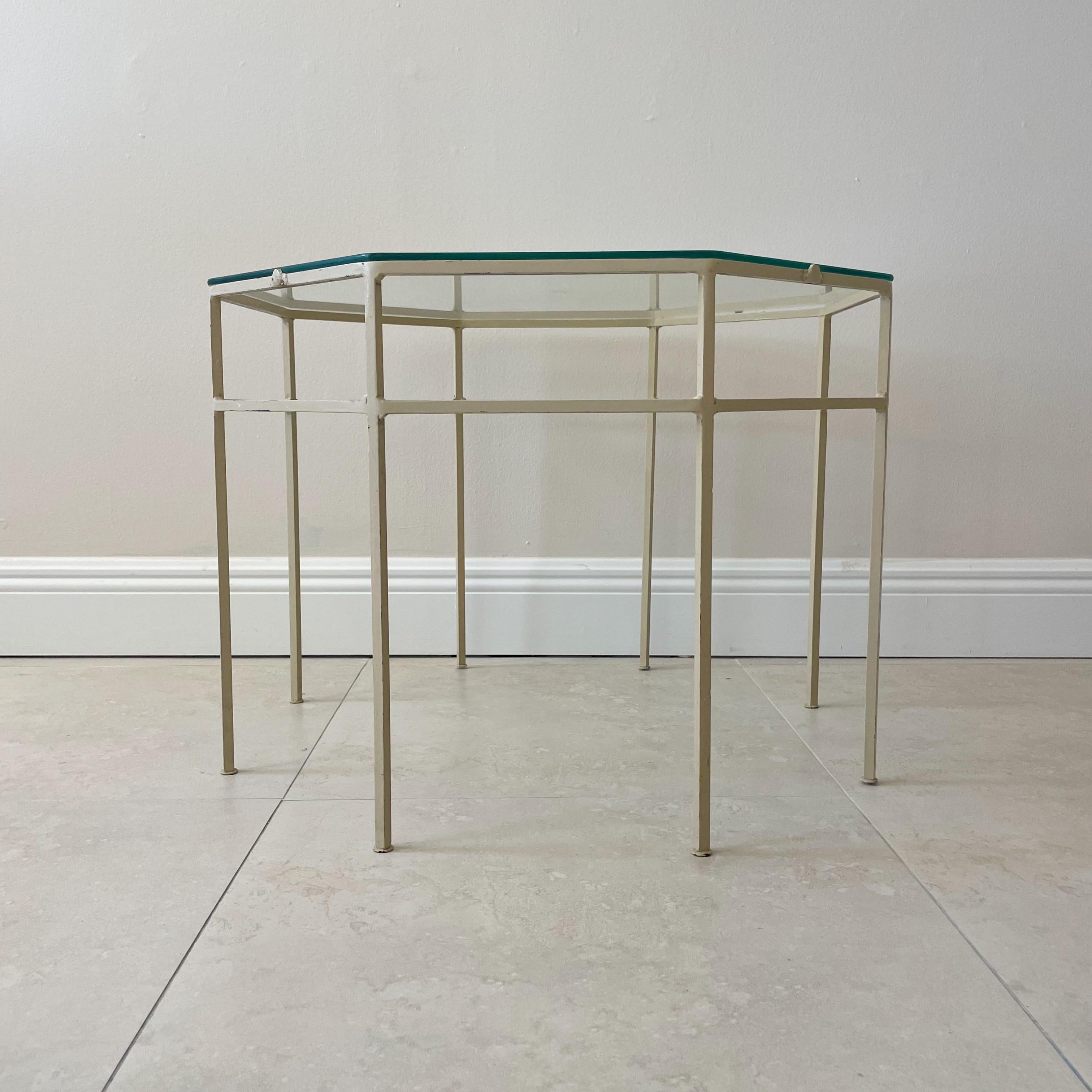 Vintage metal occasional or side table with original off white cream paint and glass top. This table retains its original finish and shows some paint loss and age appropriate wear.