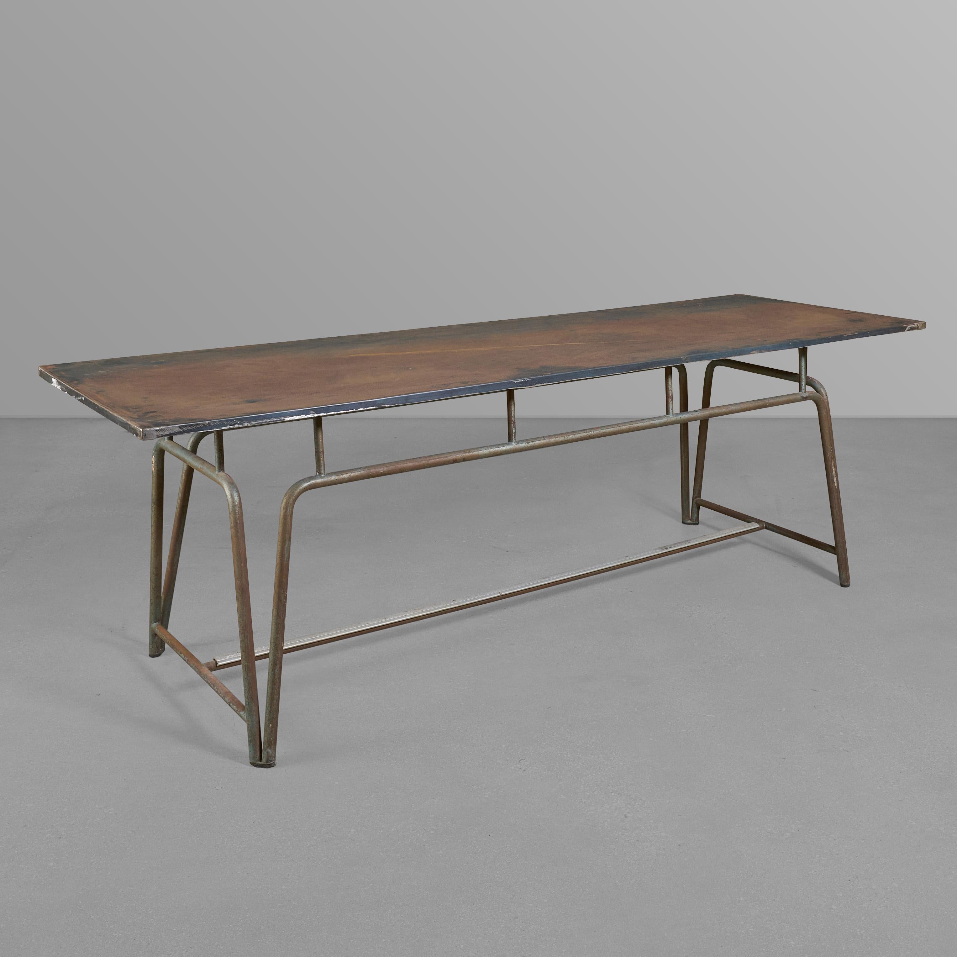 Mid-century metal table with a great base.

