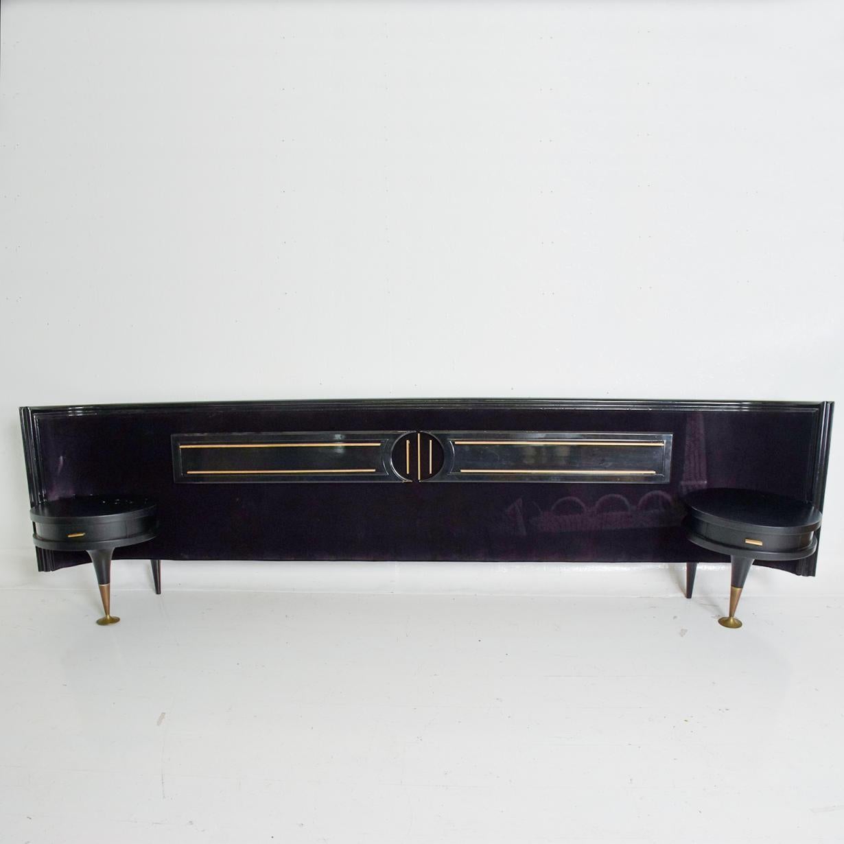 For your consideration, a midcentury Mexican modernist king size headboard with nightstands Frank Kyle.


Made in Mexico, circa 1950s.


Mahogany wood with a black finish and purple velvet upholstery. Brass accents.


Dimensions: 126 1/2