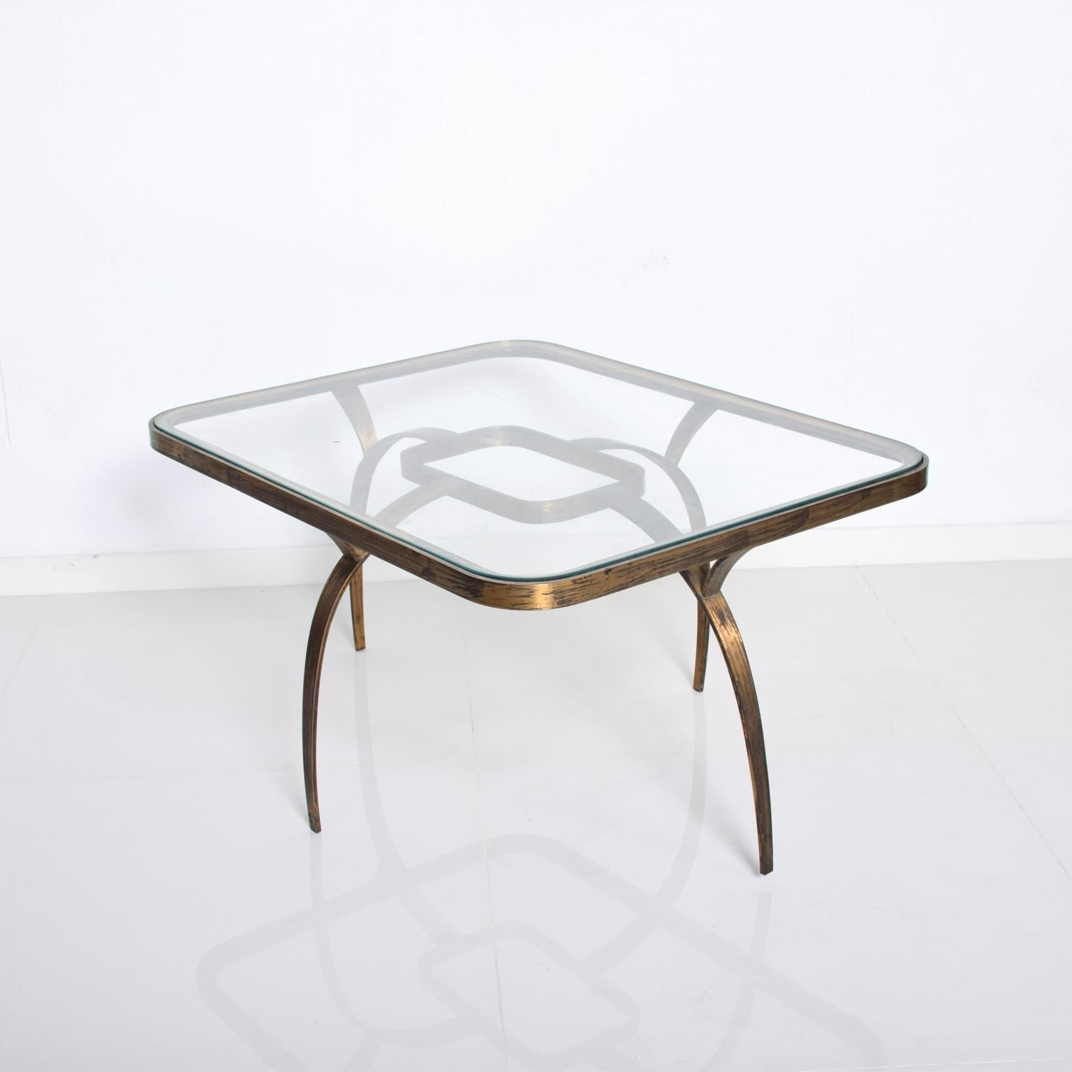 AMBIANIC presents:
Mid Century Mexican Modernist Side Coffee Table Sculptural Bronze attributed to Arturo Pani  
Constructed with bronze and glass table top. Attributed to Arturo Mexico 1950s. Unmarked.
Rectangular shape with round corners and