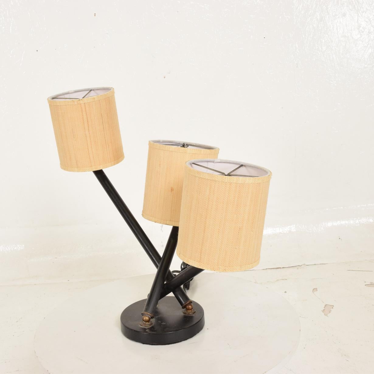 For your consideration a Mid-Century Mexican Modernist tri-arm table lamp with brass accents.

Made in Mexico, circa 1950s. 

Includes, 3 new shades.

Dimensions: 15 1/4