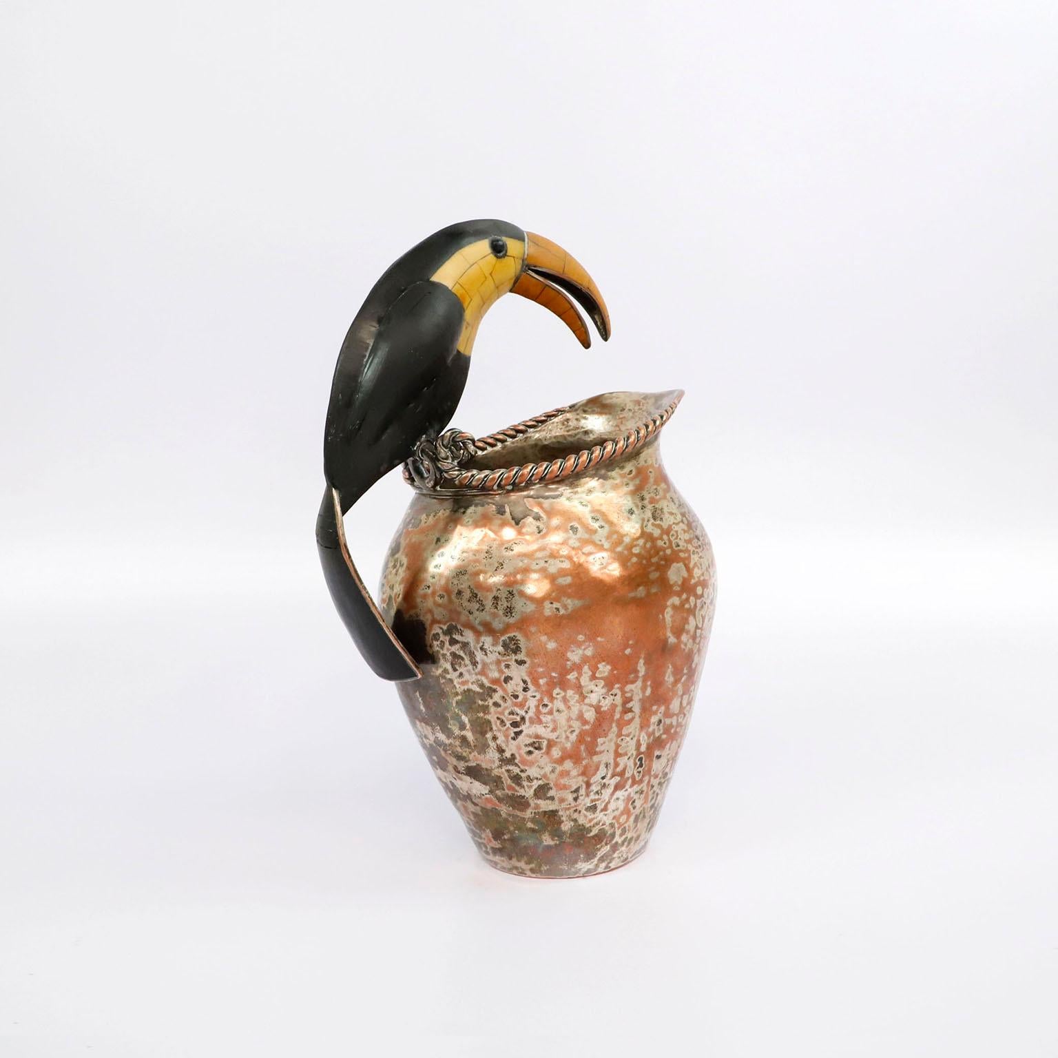 Circa 1960. We offer this Mid-Century Mexican pitcher with toucan handle by Emilia Castillo with toucan handle in great vintage condition and fantastic patina. This is an exquisite and monumental pitcher, the patina adds character but can be
