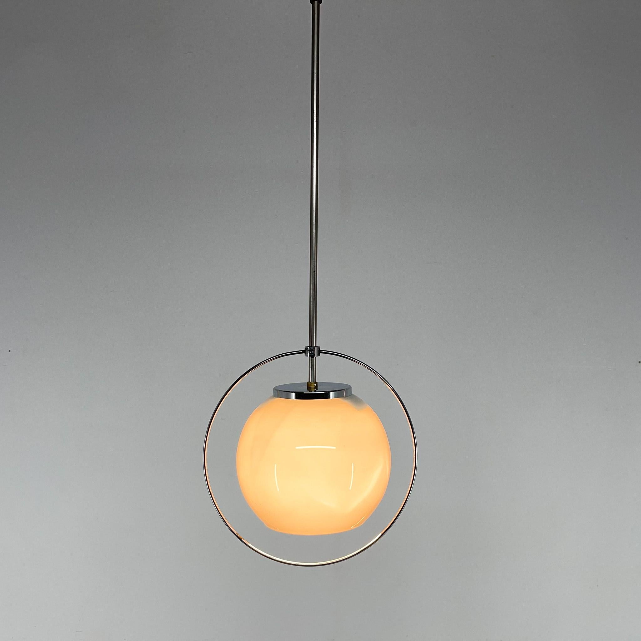 Very nice chrome pendant lamp with milk glass ball and chrome circle decoration. Bulb: 1 x E25-E27.
