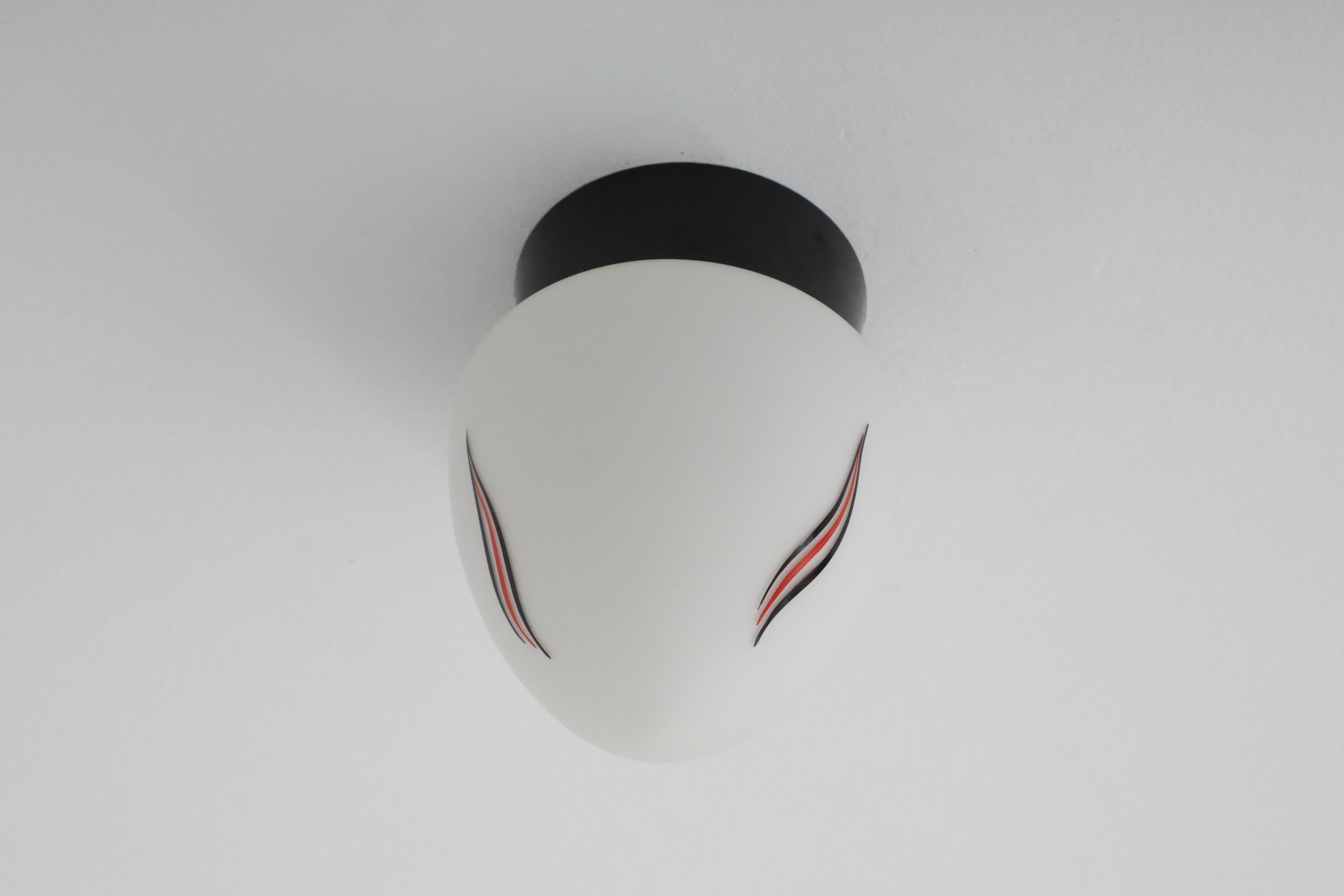 Mid-Century Milk Glass Sconce with Printed Flame Detail and Black Acrylic Base 4