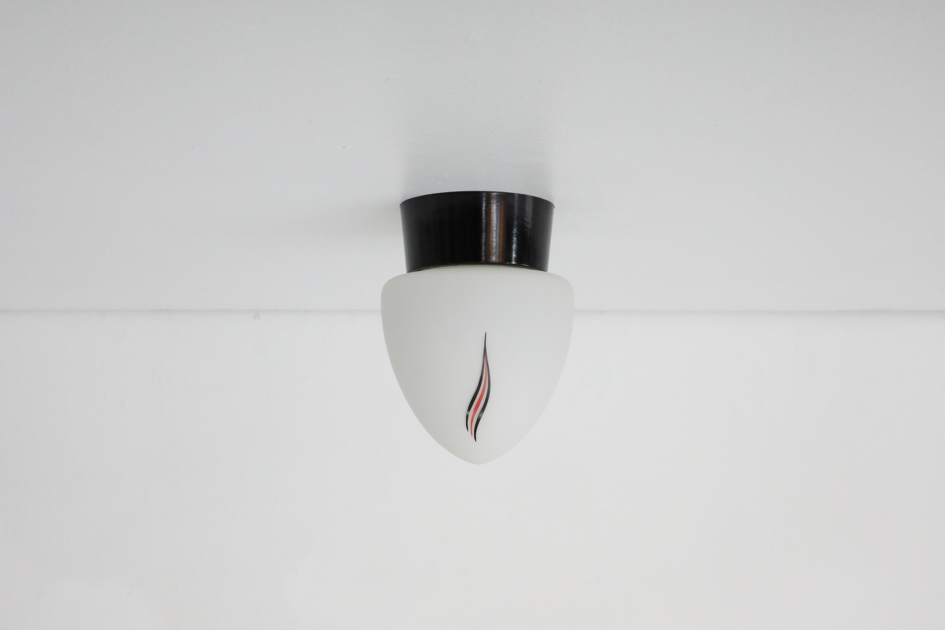 Dutch Mid-Century Milk Glass Sconce with Printed Flame Detail and Black Acrylic Base
