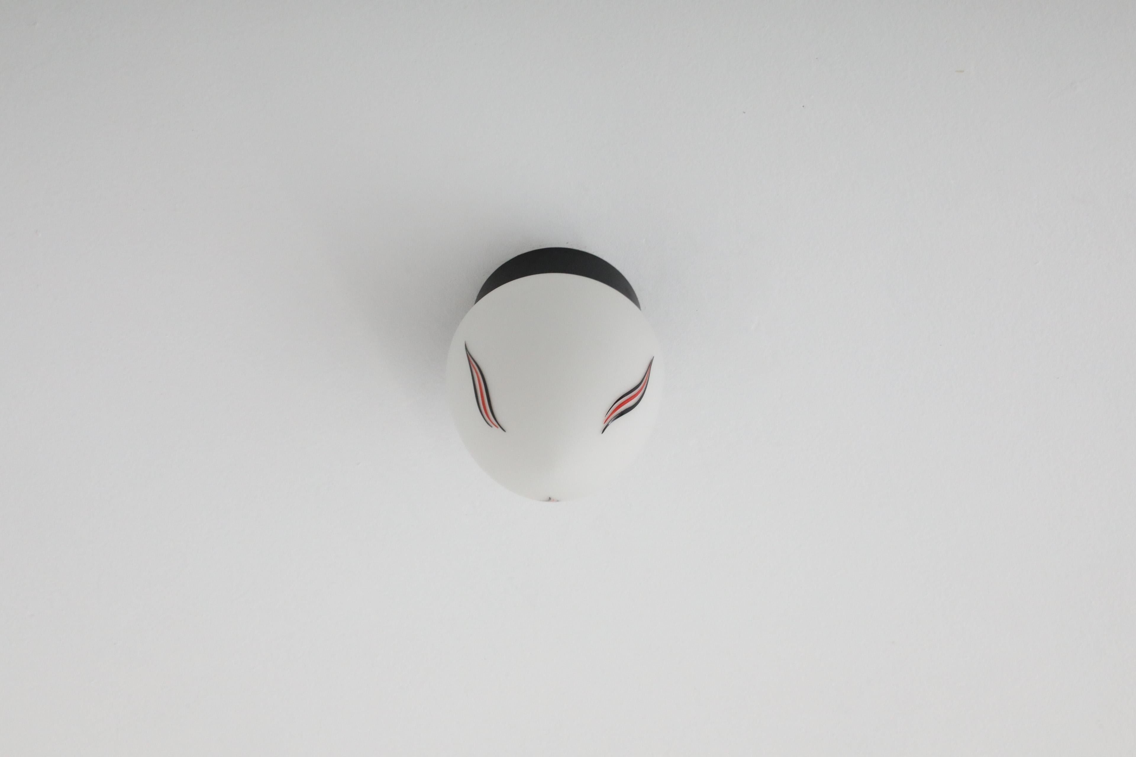 Mid-Century Milk Glass Sconce with Printed Flame Detail and Black Acrylic Base 3