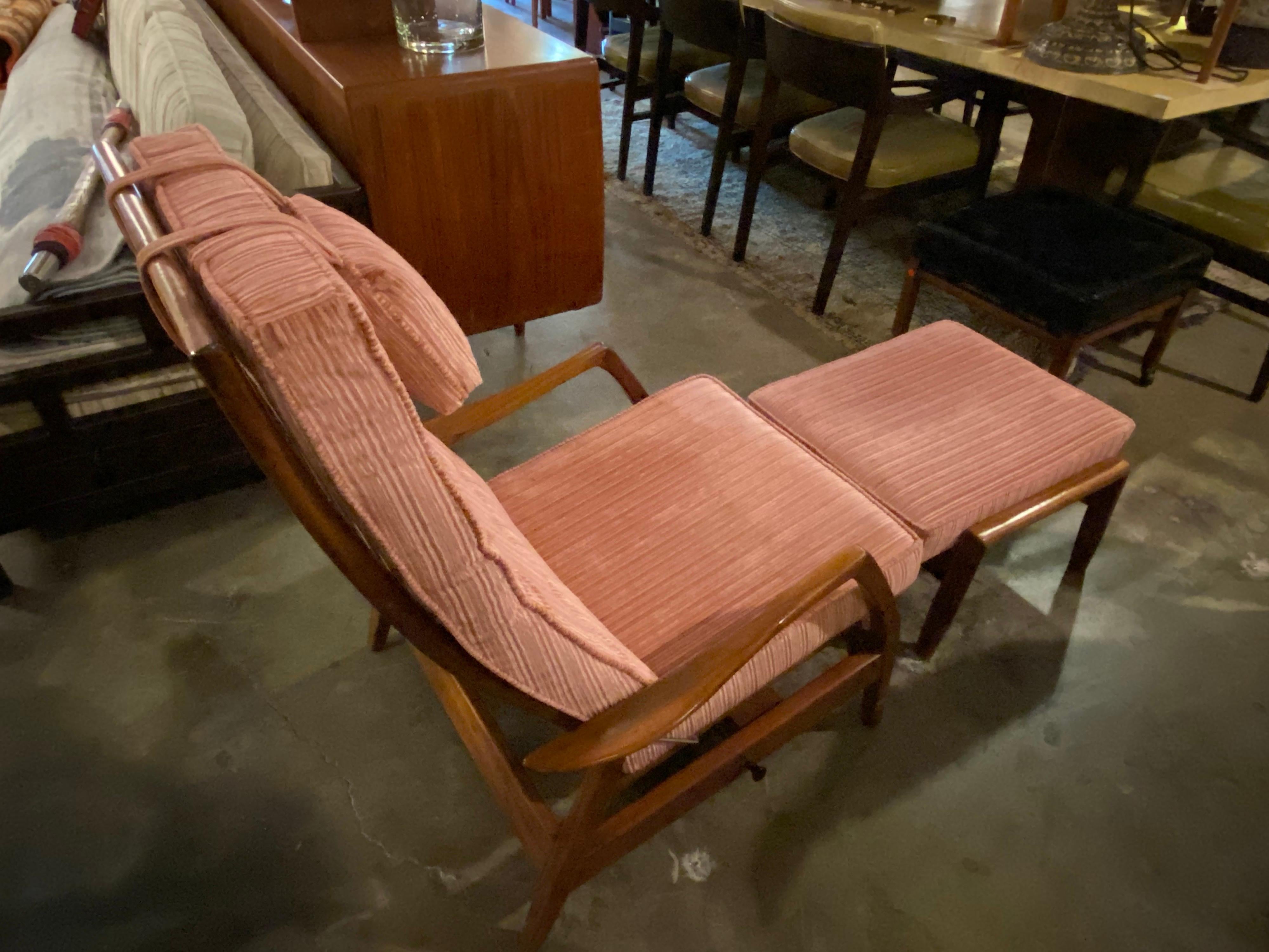 Mid-Century Modern recliner and footstool designed by Milo Baughman. This vintage recliner is adjustable and can be used as a rocker as well. The footstool can lie flat or be adjusted to an incline. Frame is made of walnut and fabric is textile with