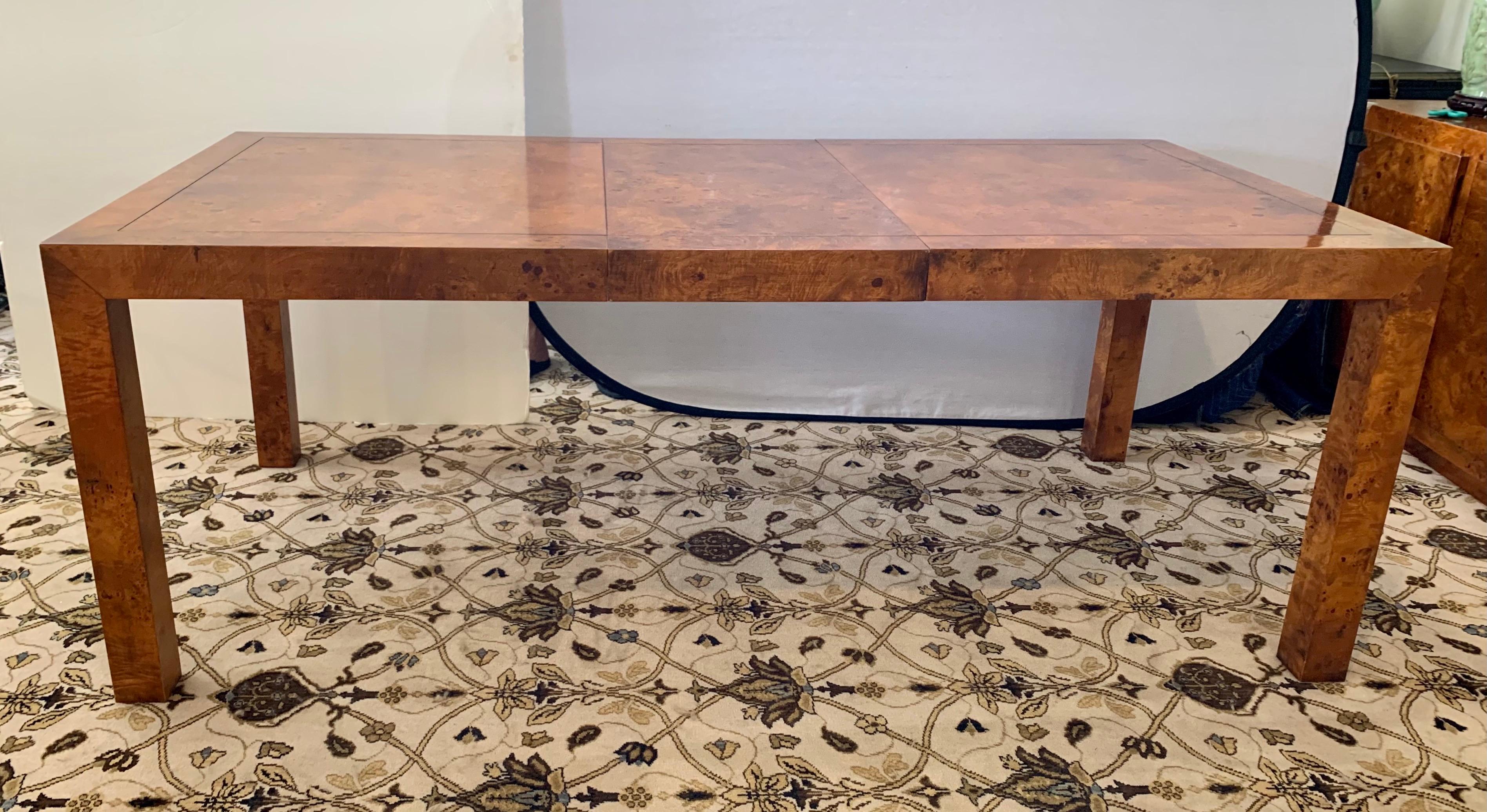 Spectacular signed vintage Parsons style extension dining or conference table with two leaves and gorgeous burlwood veneer. The table measures 60