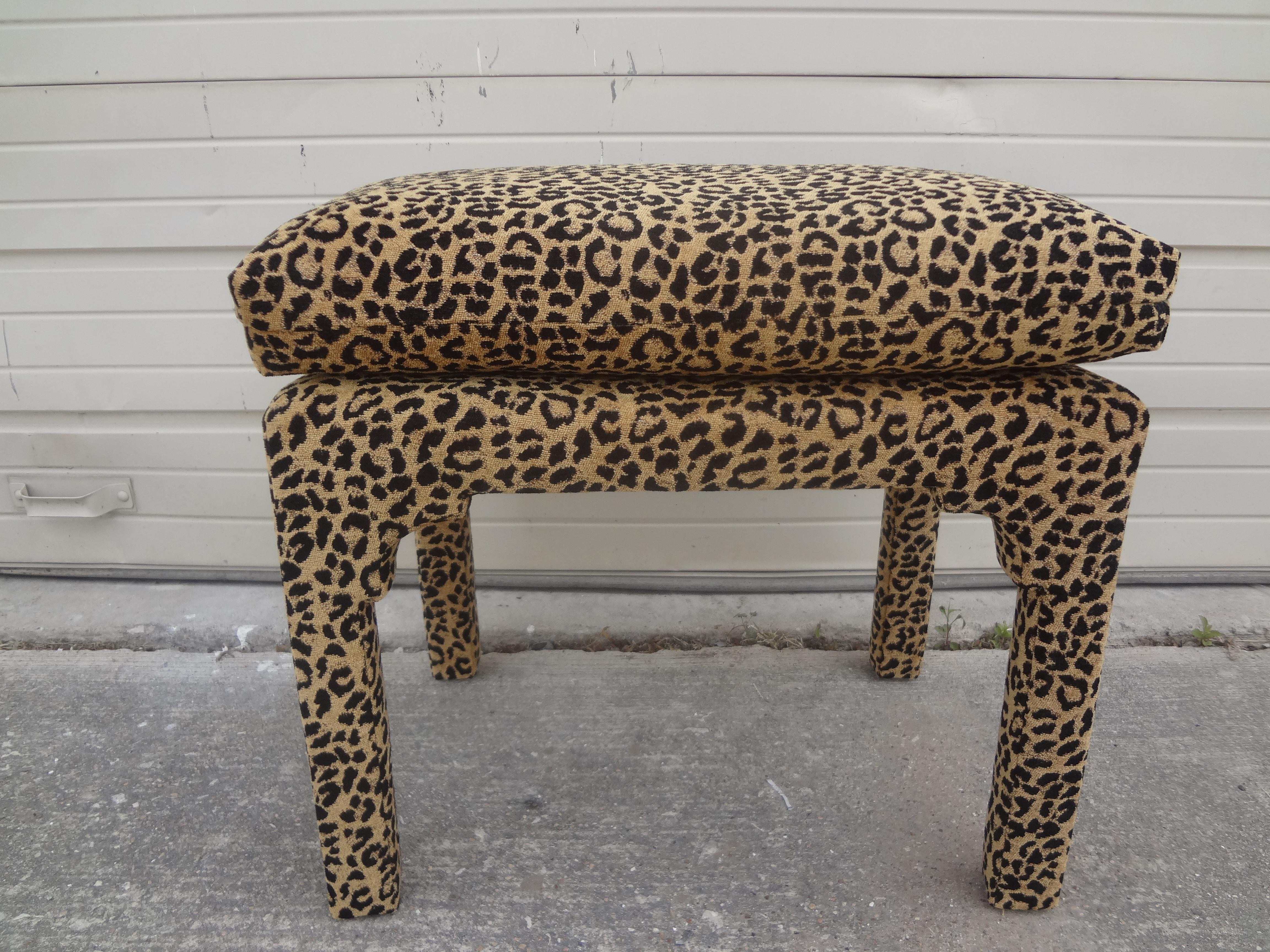 Stunning midcentury Milo Baughman Parsons style upholstered ottoman. This gorgeous Hollywood Regency Parsons ottoman, stool or bench has been professionally upholstered in a leopard print chenille fabric. Great size: 20.5 inches H, 22.25 inches W,