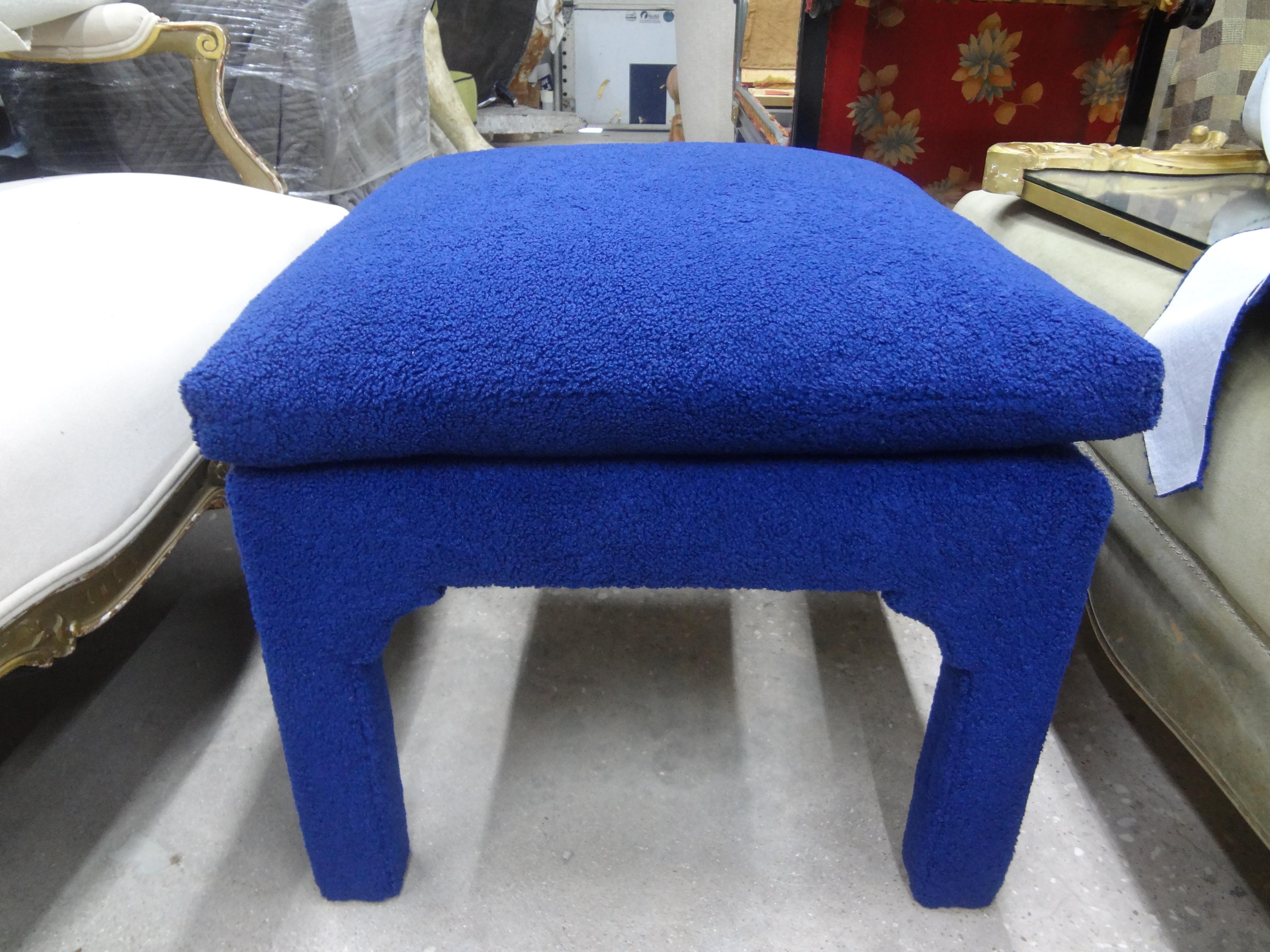 Midcentury Milo Baughman style Parsons ottoman.
Stunning midcentury Milo Baughman Parsons style upholstered ottoman. This gorgeous Hollywood Regency Parsons ottoman, bench or stool has been professionally upholstered in a plush blue bouclé fabric.