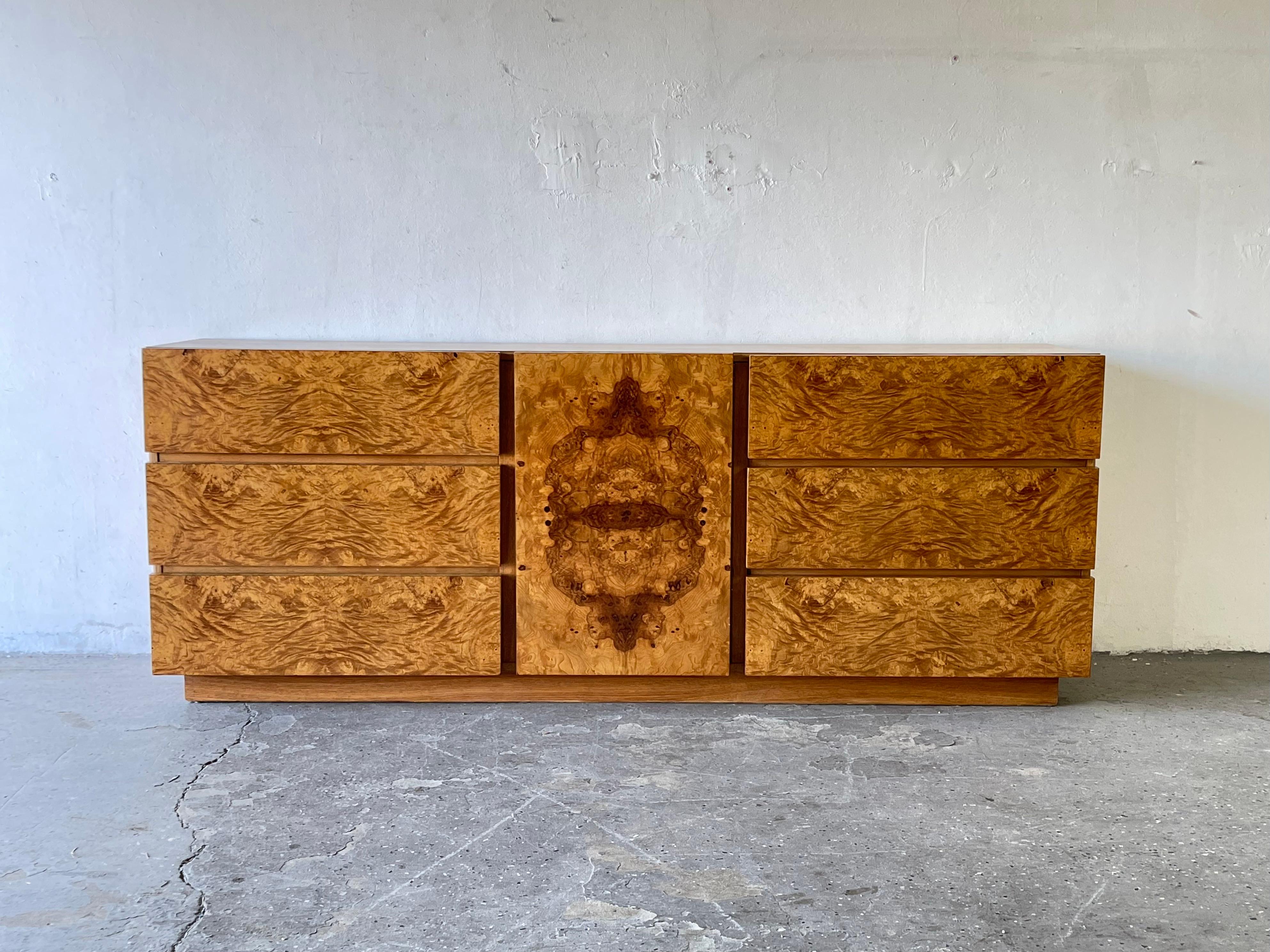 Lane burl wood Credenza / dresser. 
Absolutely gorgeous1970s burl-wood dresser. Three drawers behind middle door flanked on each side by three large drawers. Originally designed by Roland Carter for Lane Furniture, this 