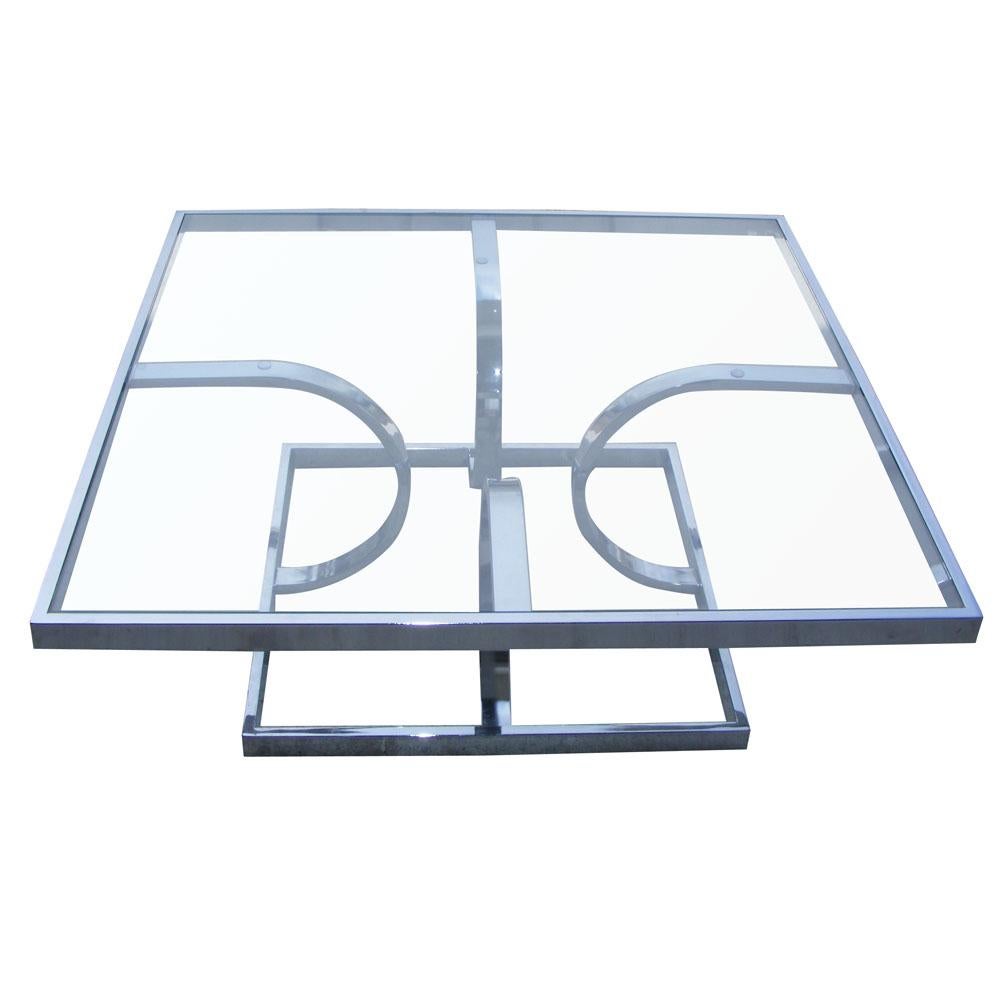 Midcentury Milo Baughman style chrome glass coffee table by DIA, with curving arcs and a square base.