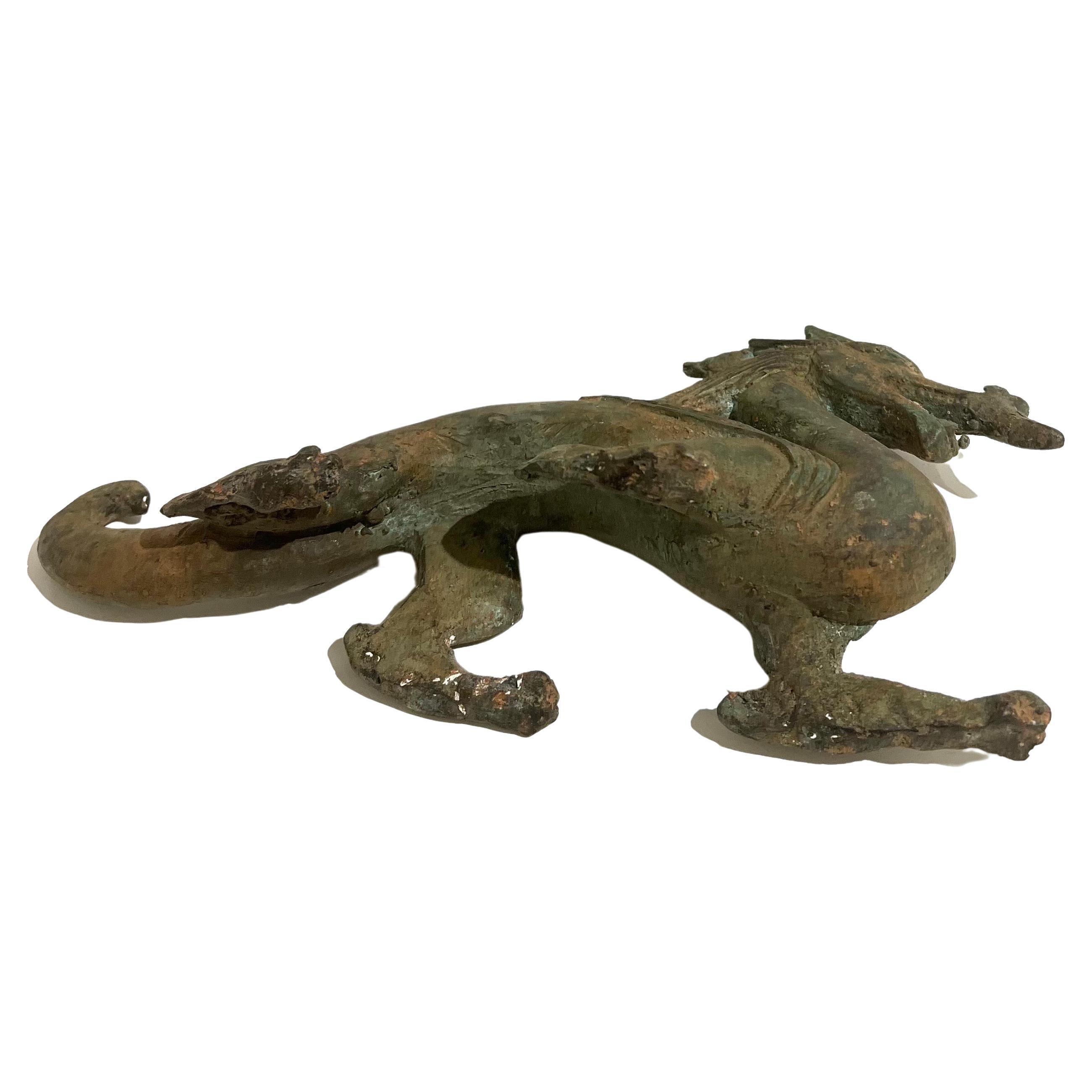 Superb detail and finish on this midcentury cast metal Chinese dragon statue. In a bronze-patinated finish.