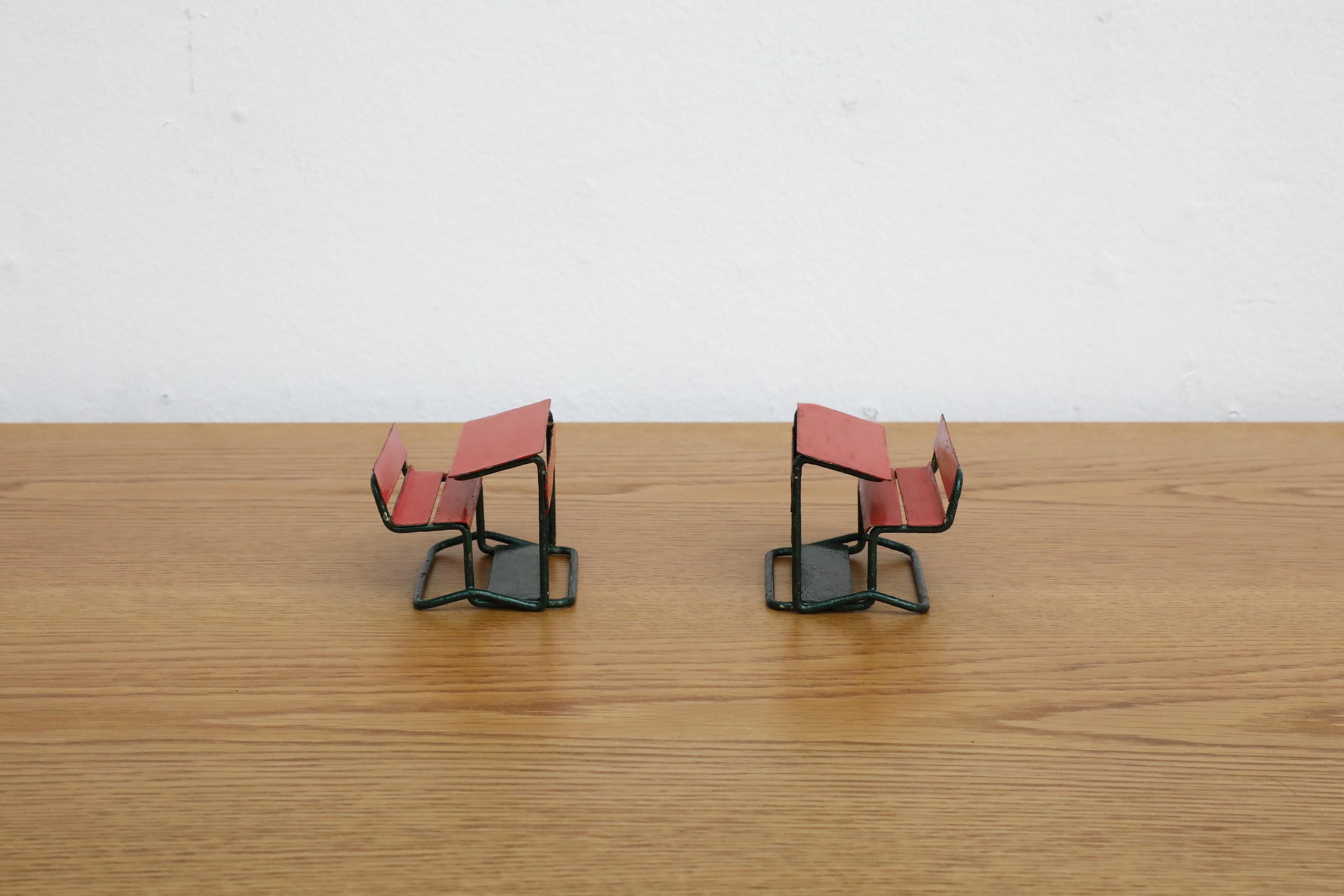 Adorable vintage mini school desks in red and green wire and painted metal. In original condition with visible wear including loss of paint. A little matching lounge chair set is also available and listed separately, (LU922440217922). Priced