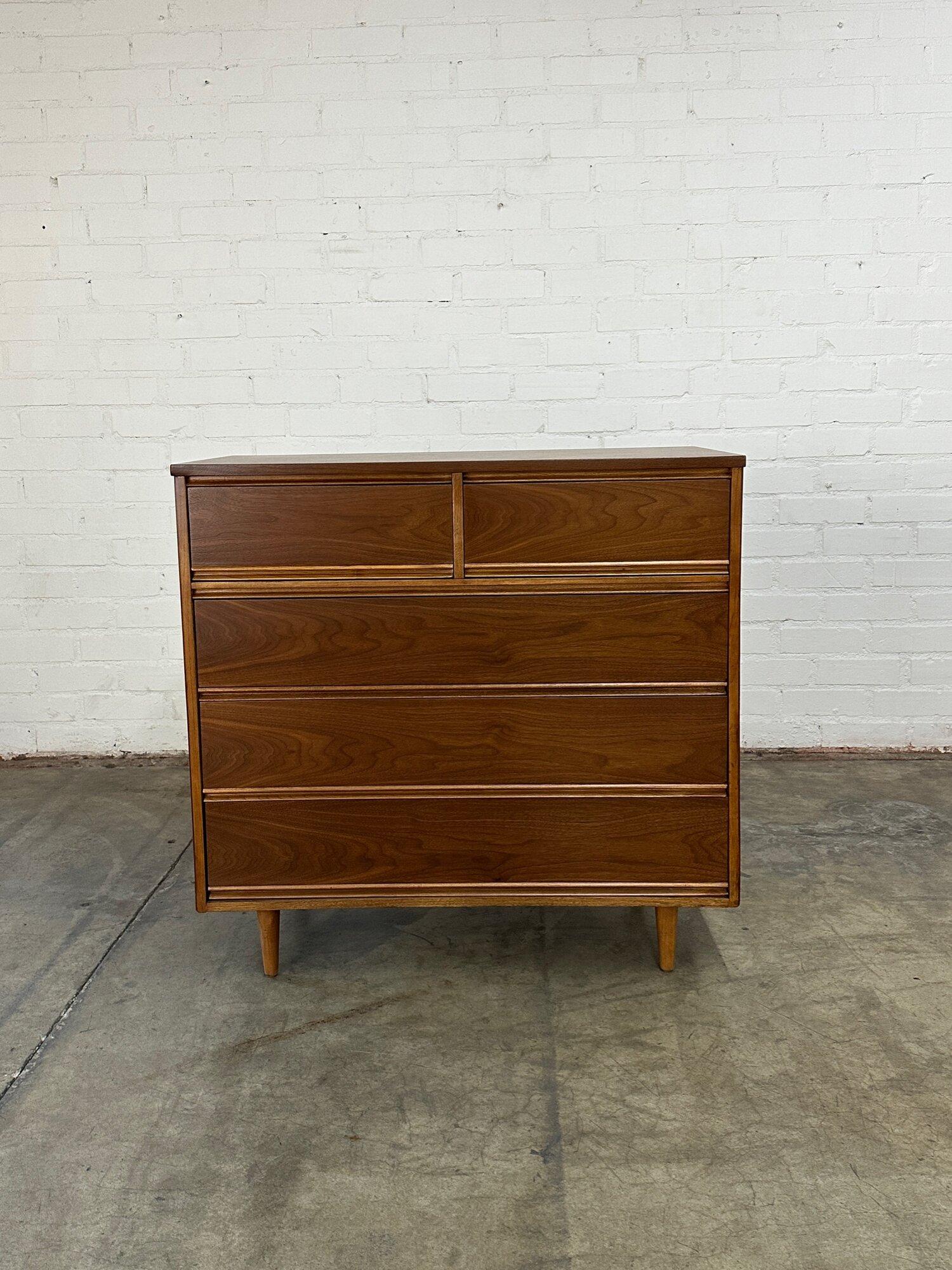 W42.5 D19 H40

1960s highboy dresser with 5 fully functional drawers on wooden sliders. Drawers are clean and highboy is strong and sturdy. The full piece has been restored. Drawers open with recessed pulled under drawer front. 