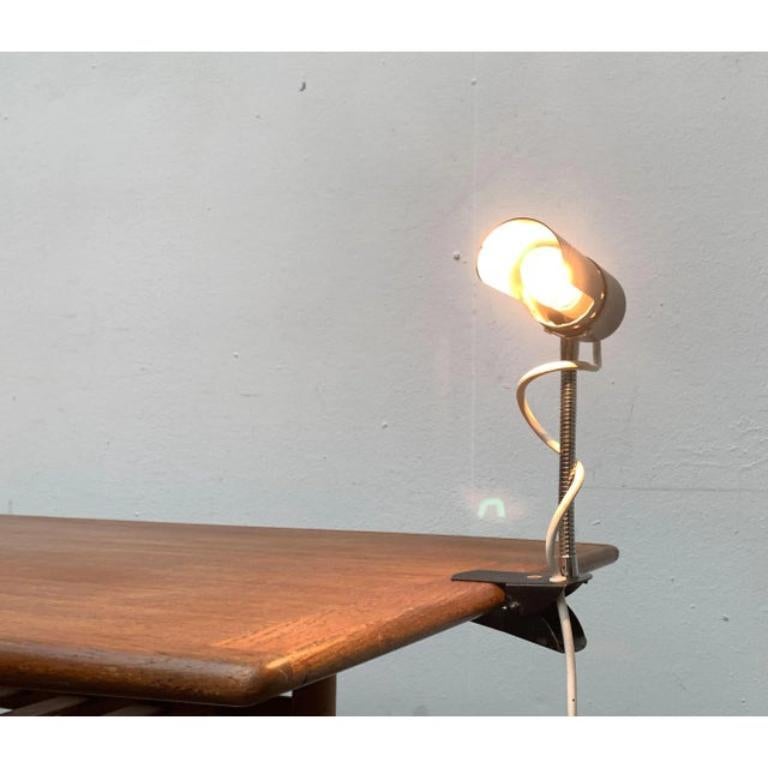 Mid-Century Minimalist Clamp Table Lamp, 1960s, in Very Good conditions. Designed 1960 to 1969.

Additional information:
Material: Metal
Color: Black
Styles: Mid-Century Modern
Item Type: Vintage, Antique or Pre-owned
Diamension: 7.09ʺW × 2.36ʺD ×