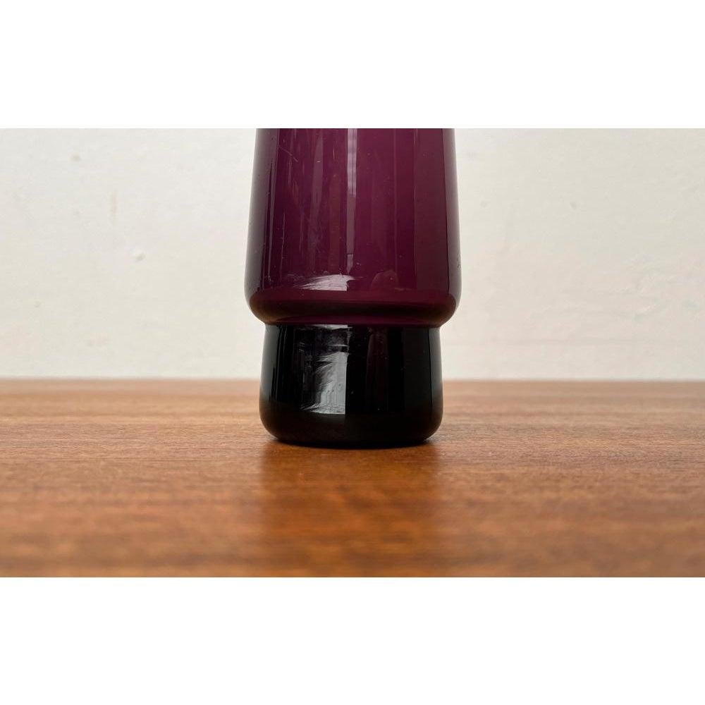Mid-Century Minimalist Glass Vase, 1960s, in Very Good conditions. Designed 1960 to 1969.

Additional information:
Materials: Glass
Color: Purple
Styles: Mid-Century Modern, Minimalist
Item Type: Vintage, Antique or Pre-owned
Dimensions: 2.36ʺW ×