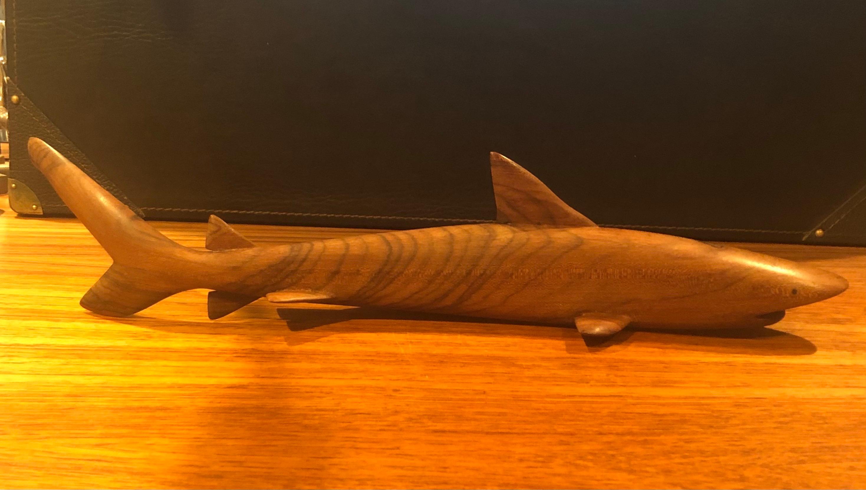 A very cool midcentury Minimalist shark carving / sculpture in rosewood, circa 1970s. The piece measures 19.5